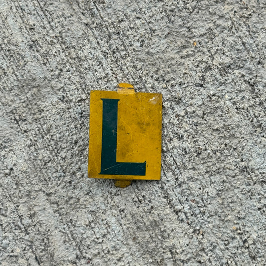Photo of a 1960 Era Sunoco Gas Oil Arrow License Plate Topper Auto Tag Garage Decor Vintage Letter L Insert Initials Name with original patina
