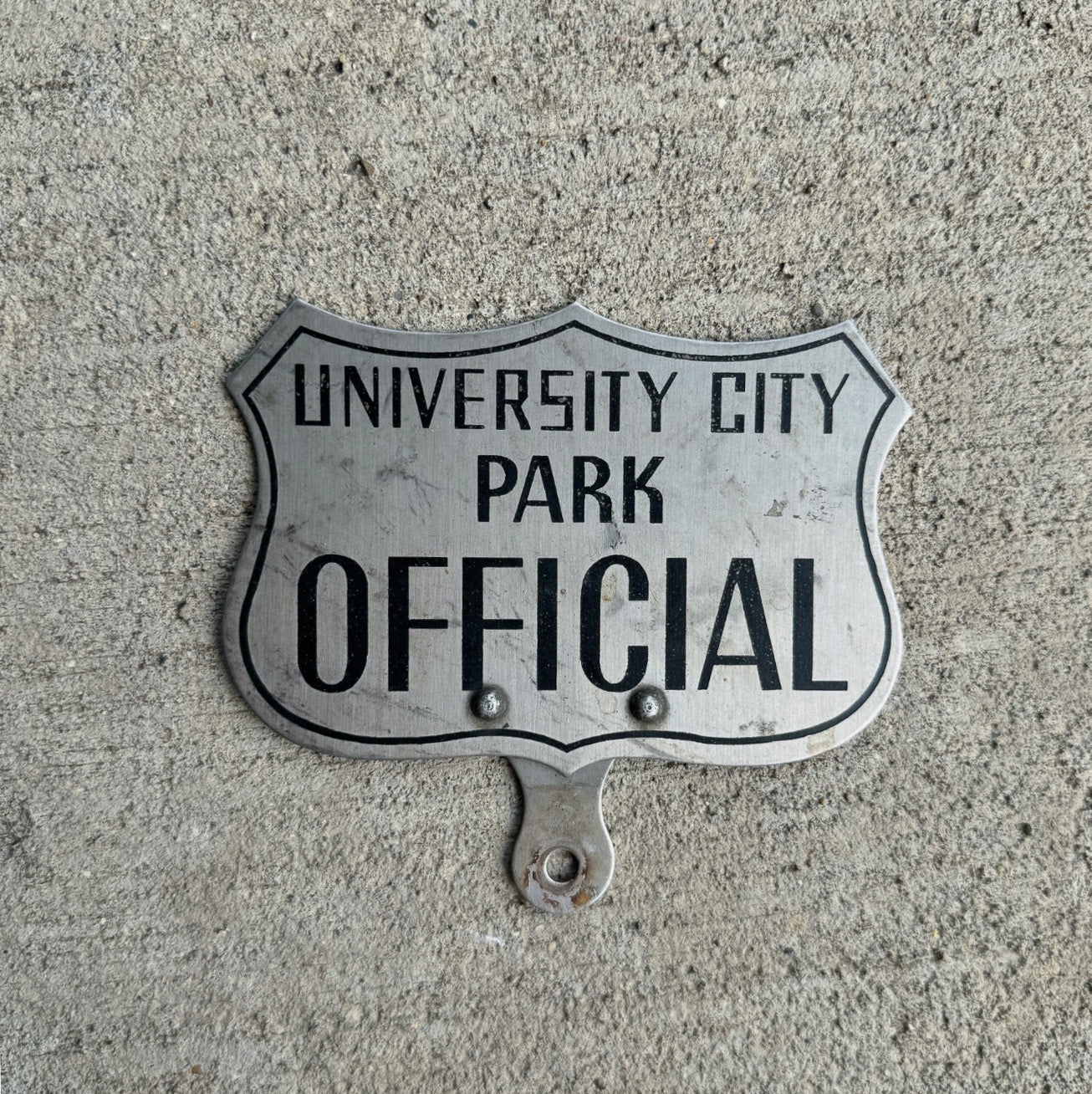 Photo of a 1960 Era University City Missouri License Plate Topper Auto Tag Garage Decor Vintage St. Louis Park Official with original patina