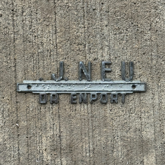 Photo of a 1960 Era VJ Neu Davenport Iowa Dealer Badge Emblem Auto Tag Garage Decor Vintage Oldsmobile Dealership with original patina