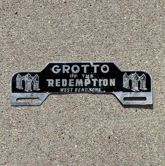 Photo of a 1960 Era West Bend Iowa License Plate Topper Auto Tag Garage Decor Vintage Vintage Grotto of the Redemption with original patina