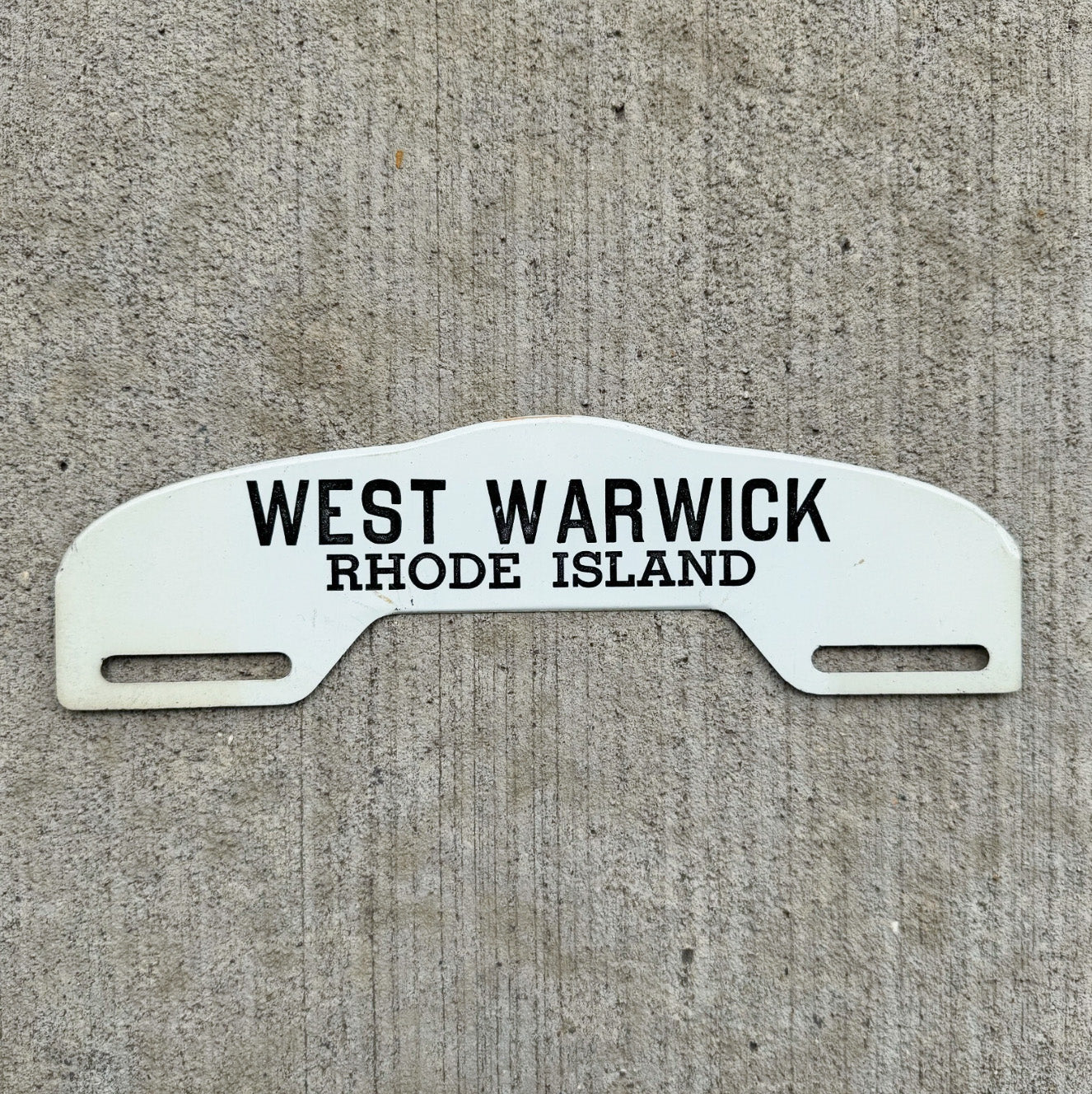 Photo of a 1960 Era West Warwick Rhode Island License Plate Topper Auto Tag Garage Decor Vintage Black White Auto Garage with original patina