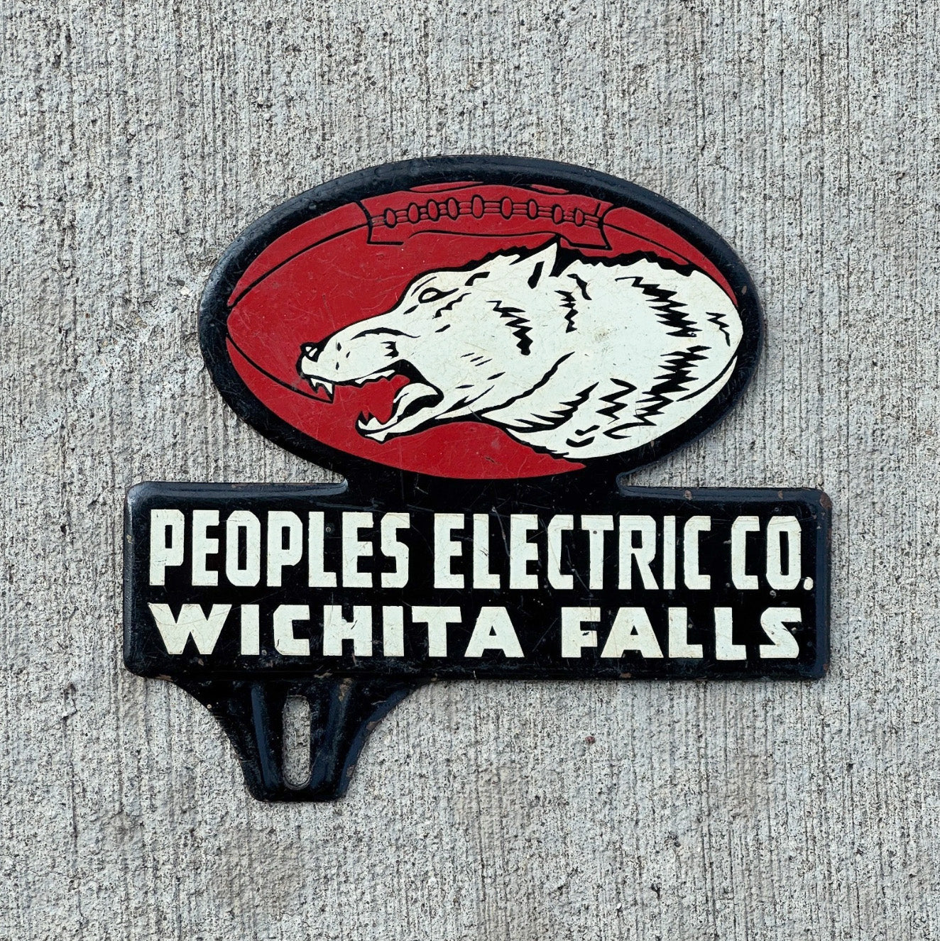 Photo of a 1960 Era Wichita Falls Texas License Plate Topper Auto Tag Garage Decor Vintage Peoples Electric Football Wolf with original patina