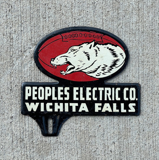 Photo of a 1960 Era Wichita Falls Texas License Plate Topper Auto Tag Garage Decor Vintage Peoples Electric Football Wolf with original patina