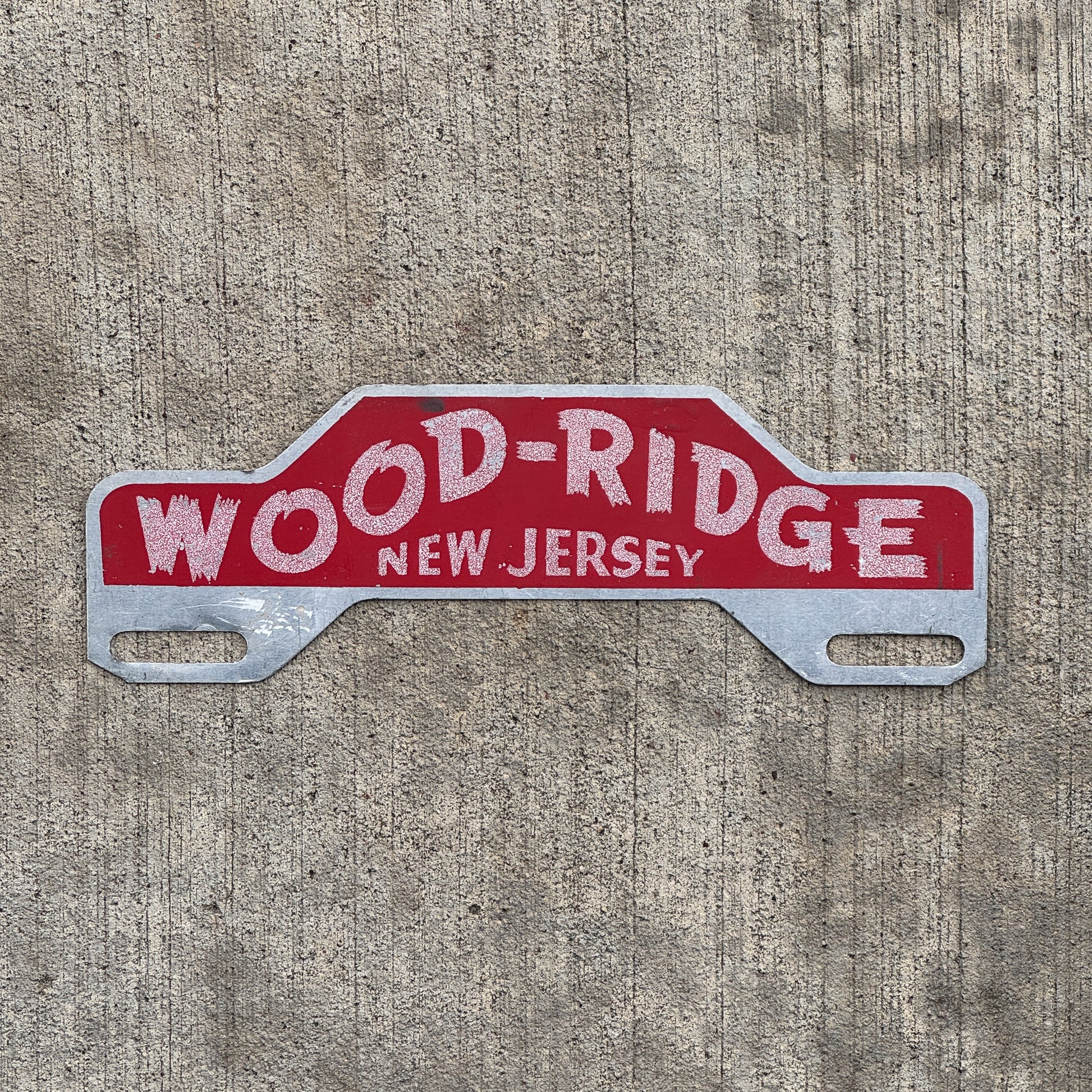 Photo of a 1960 Era Wood-Ridge New Jersey License Plate Topper Auto Tag Garage Decor Vintage with original patina