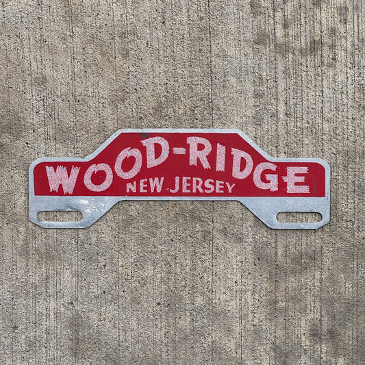Photo of a 1960 Era Wood-Ridge New Jersey License Plate Topper Auto Tag Garage Decor Vintage with original patina