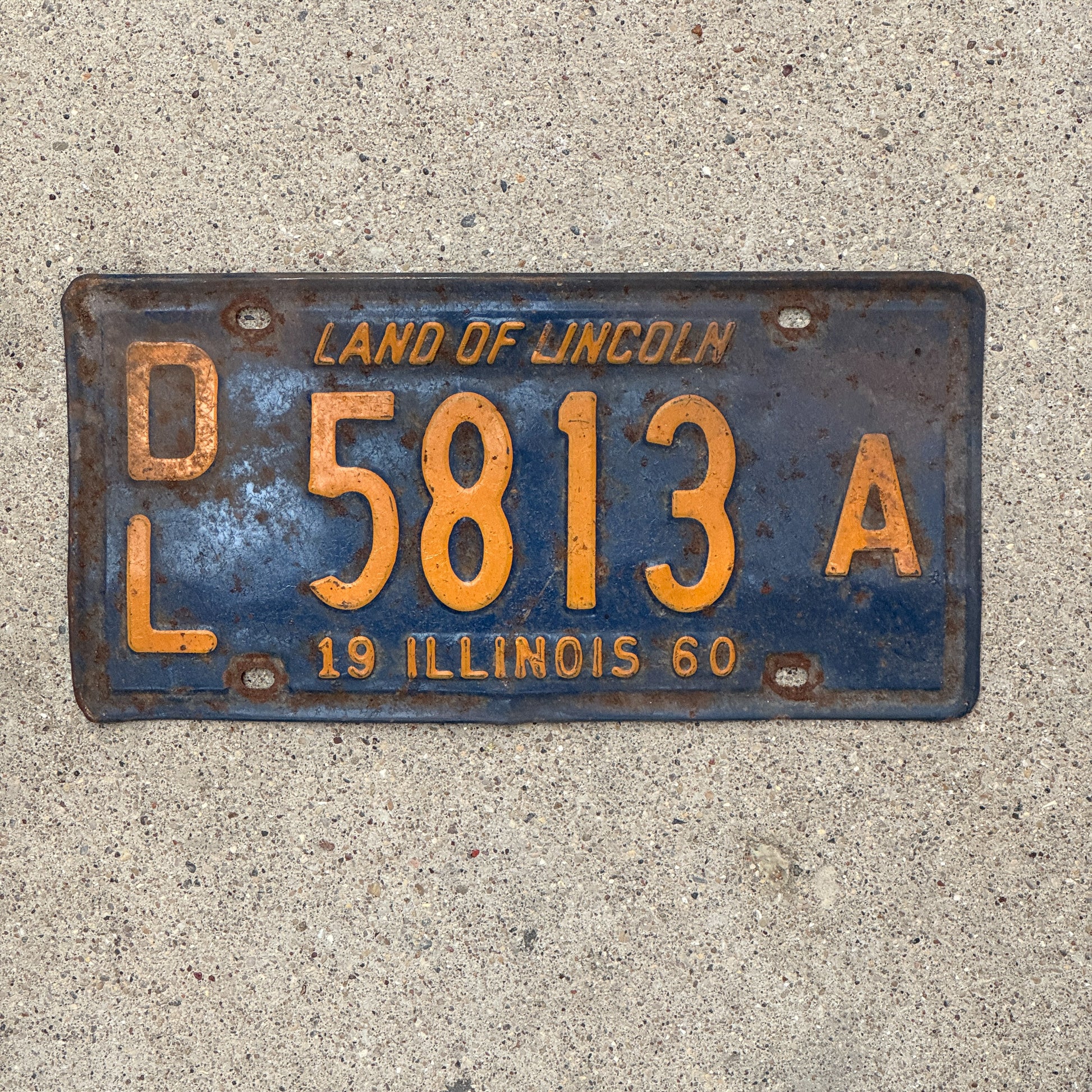 Photo of a 1960 Illinois Dealer License Plate Auto Tag 1 Vintage Garage Orange Blue 5813 A with original patina
