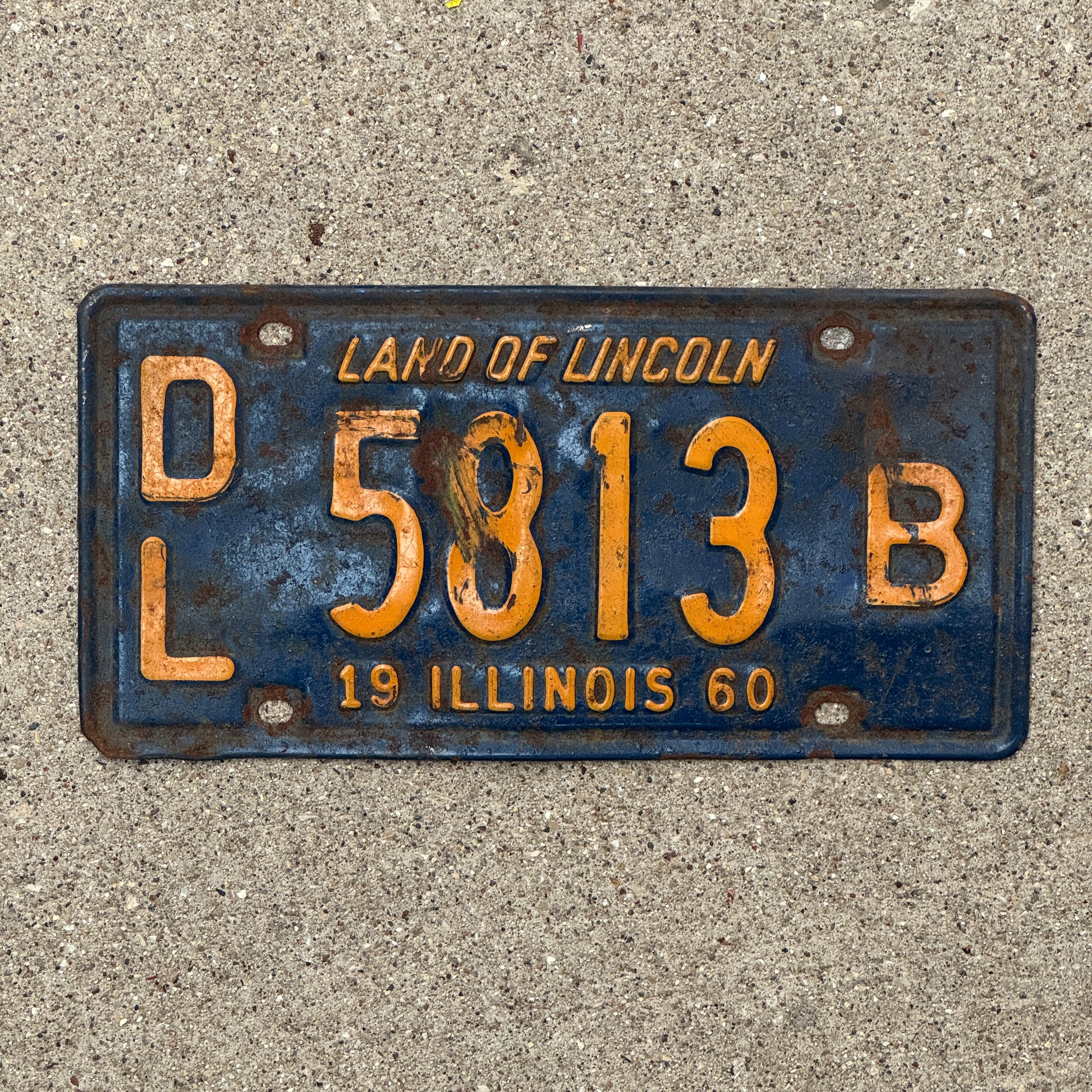 Photo of a 1960 Illinois Dealer License Plate Auto Tag 1 Vintage Garage Orange Blue 5813 B with original patina