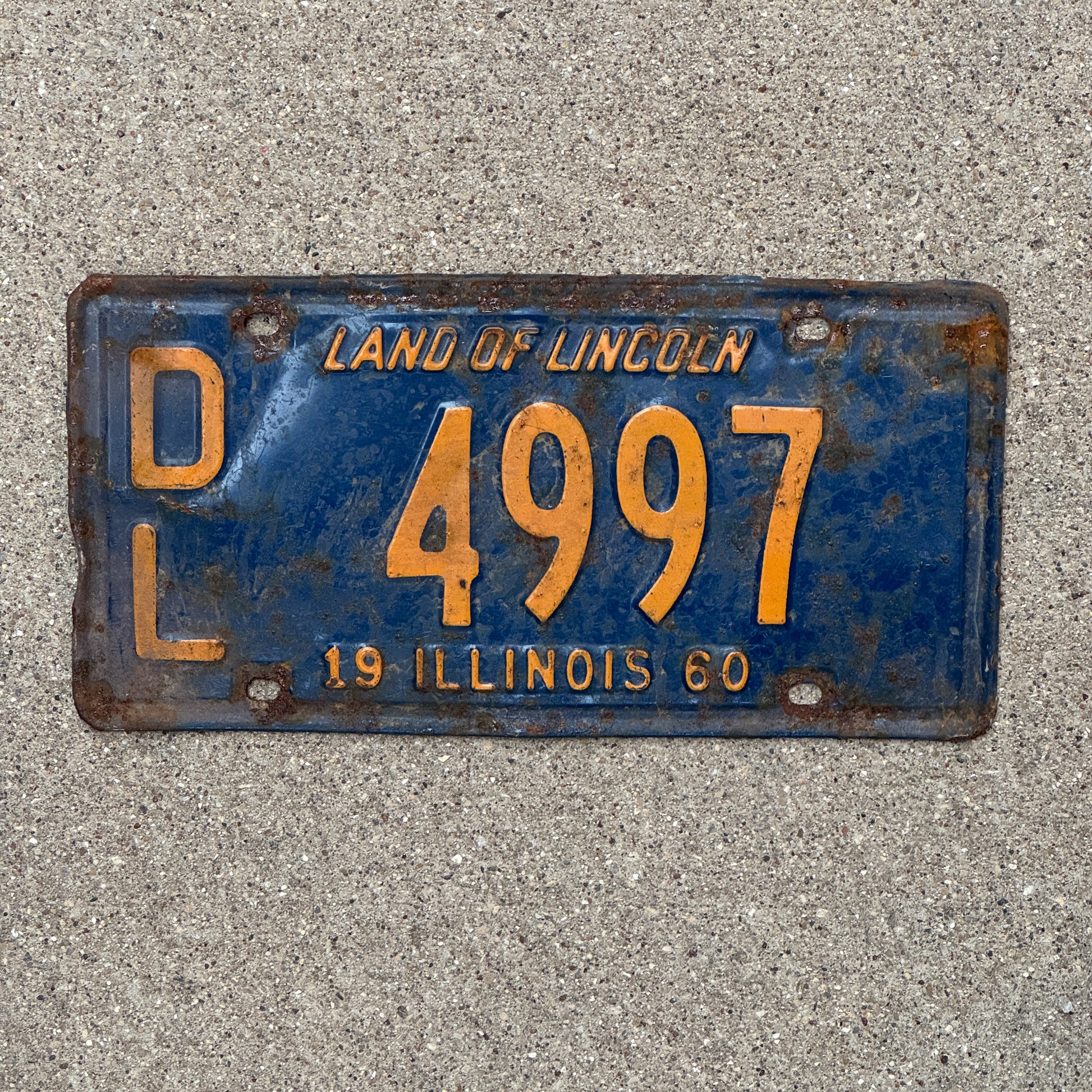 Photo of a 1960 Illinois Dealer License Plate Auto Tag Garage Decor Vintage Orange Blue 4997 with original patina