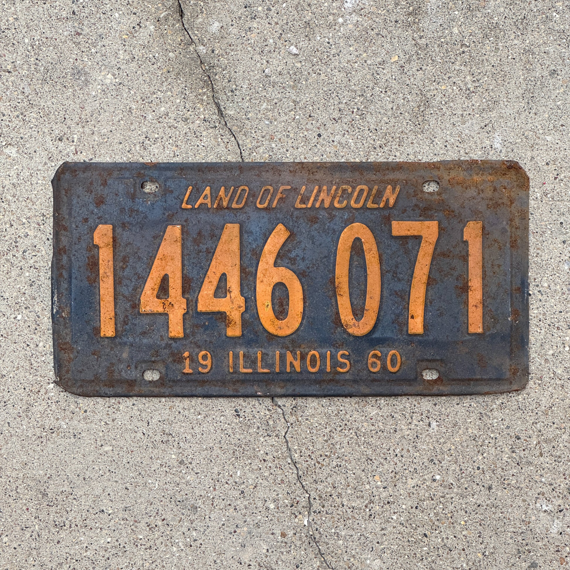Photo of a 1960 Illinois License Plate Auto Tag 1 Vintage Garage Orange Blue 1 446 071 with original patina