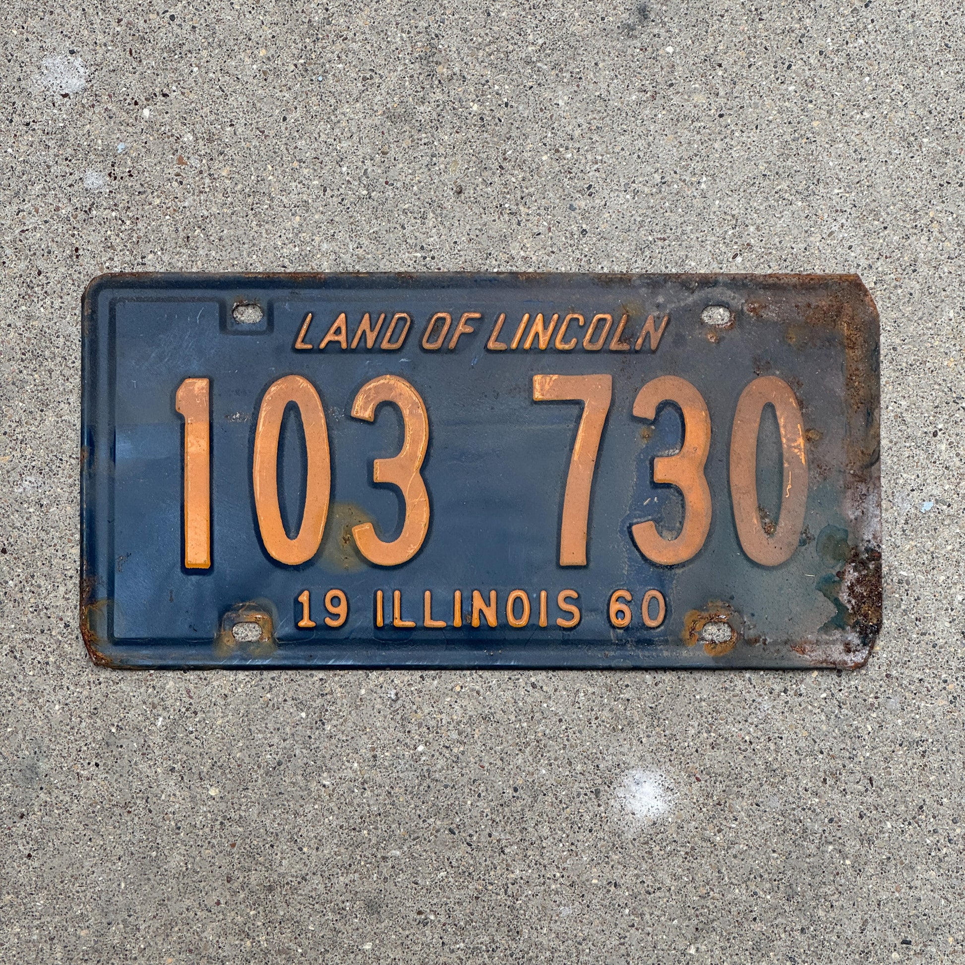 Photo of a 1960 Illinois License Plate Auto Tag 1 Vintage Garage Orange Blue 103 730 with original patina