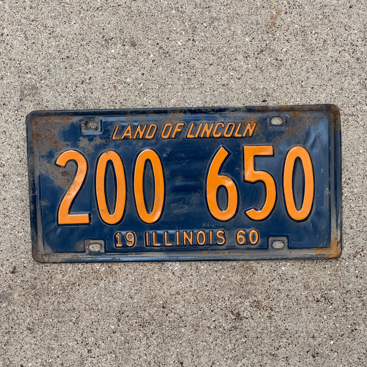 Photo of a 1960 Illinois License Plate Auto Tag 1 Vintage Garage Orange Blue 200 650 with original patina