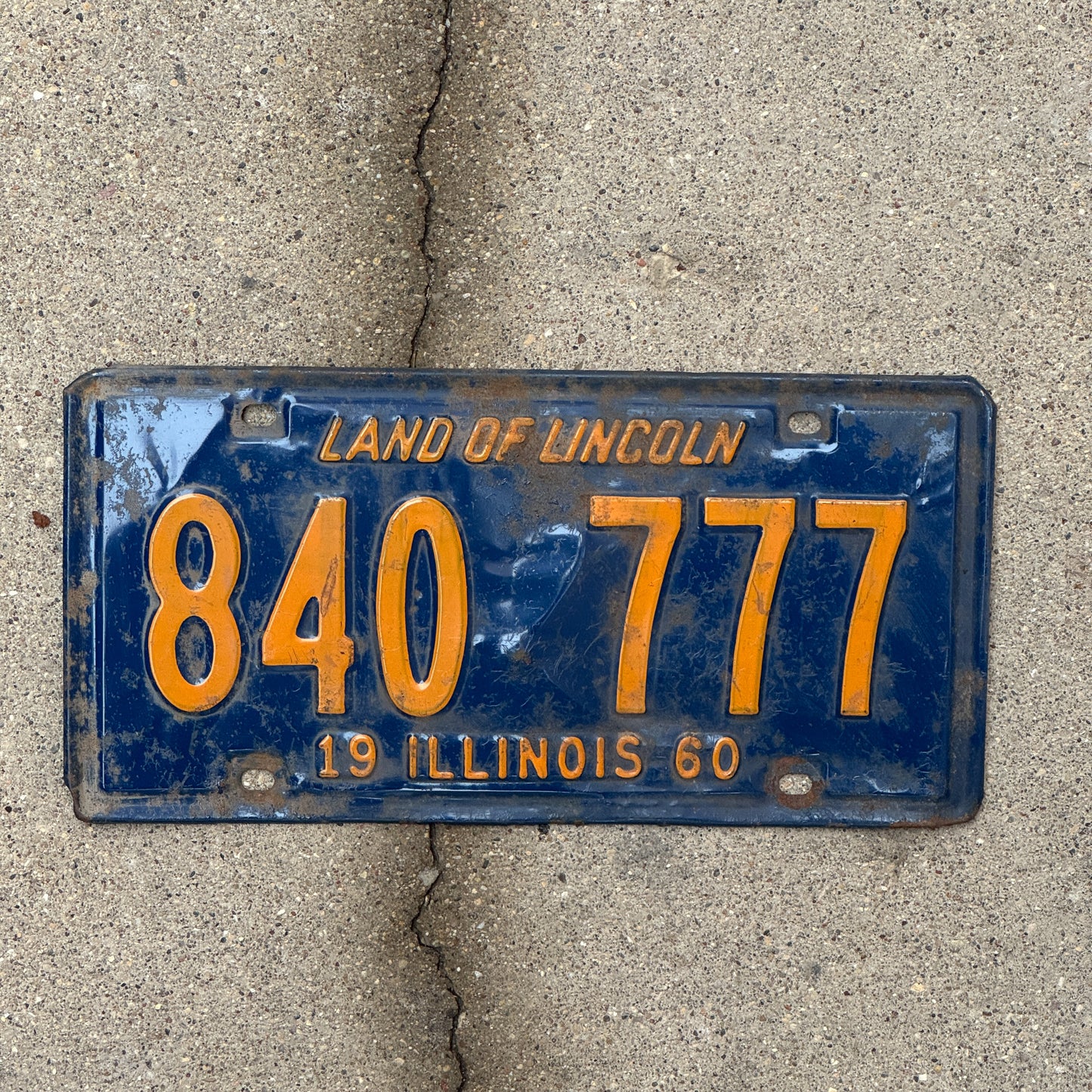 Photo of a 1960 Illinois License Plate Auto Tag 2 Vintage Garage Lucky 7s Repeat Repeating Orange Blue 840 777 with original patina