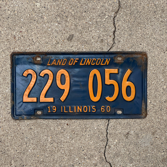 Photo of a 1960 Illinois License Plate Auto Tag 2 Vintage Garage Orange Blue 229 056 with original patina
