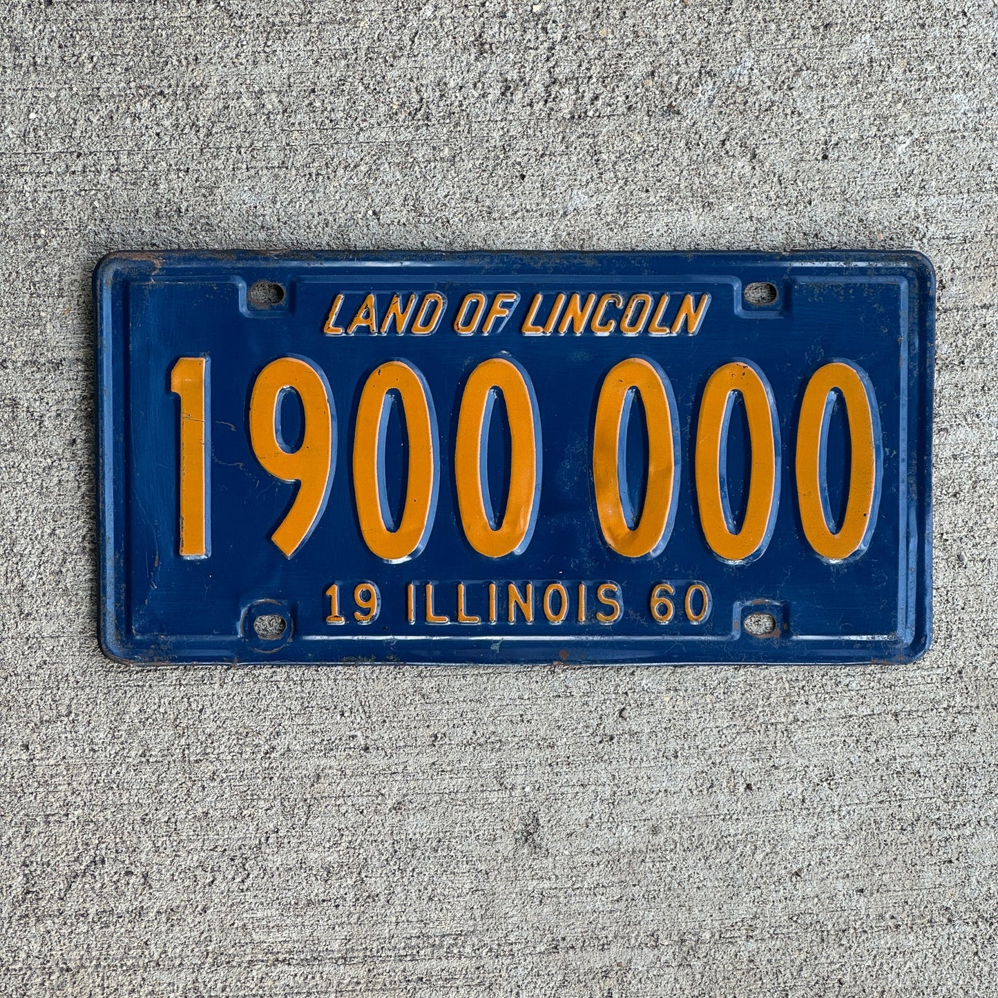 Photo of a 1960 Illinois License Plate Auto Tag Garage Decor Vintage 1900000 with original patina
