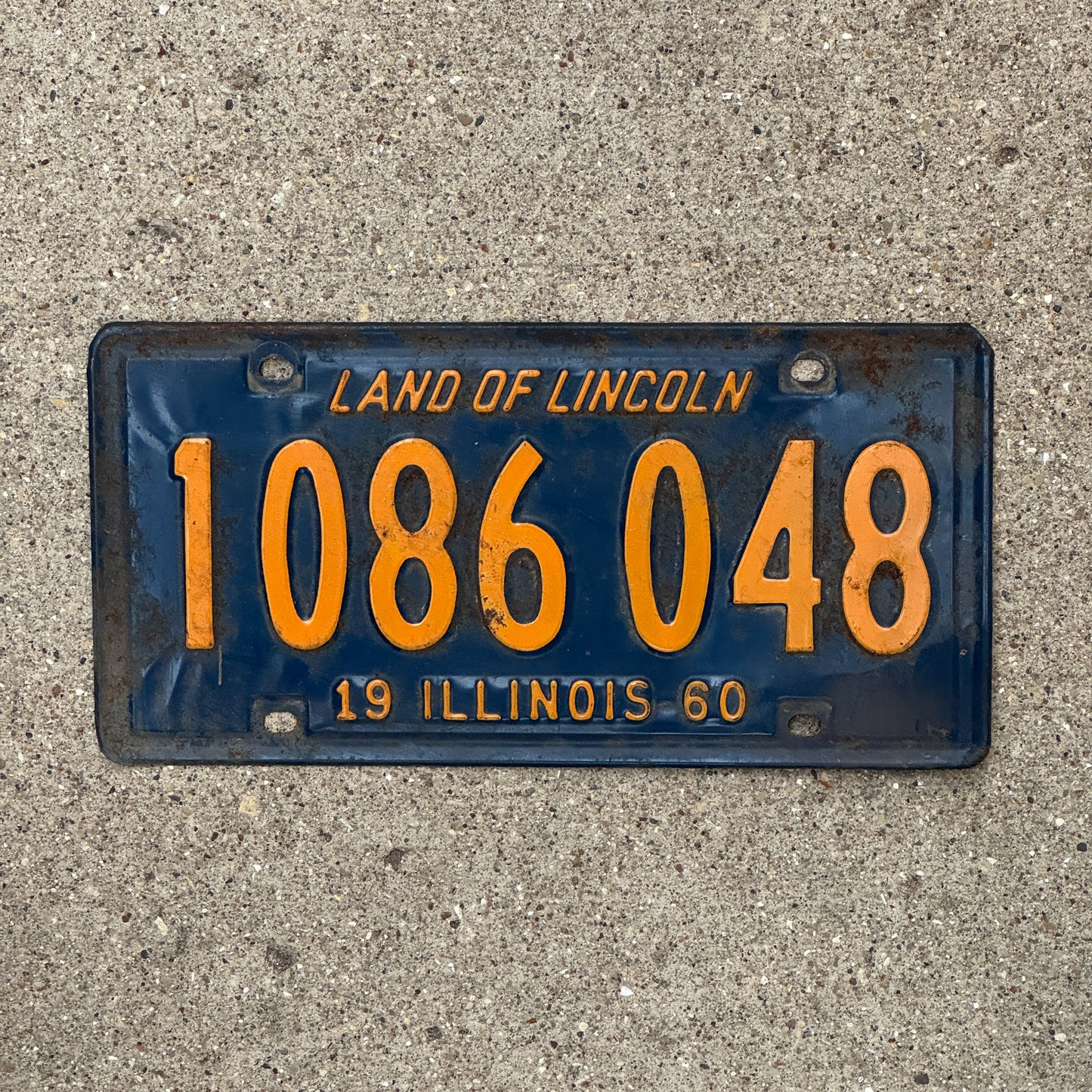 Photo of a 1960 Illinois License Plate Auto Tag Garage Decor Vintage Orange Blue 1 086 048 with original patina