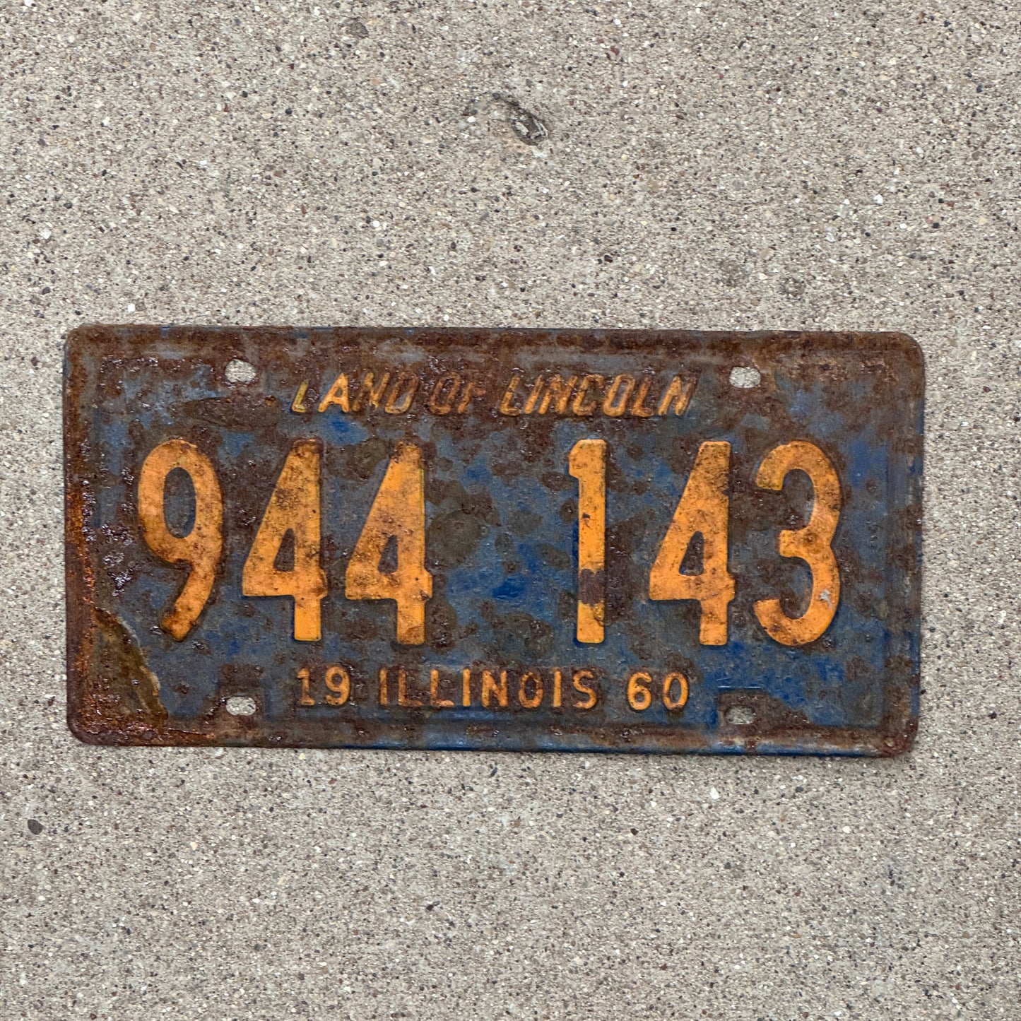 Photo of a 1960 Illinois License Plate Auto Tag Garage Decor Vintage Orange Blue 944 143 with original patina