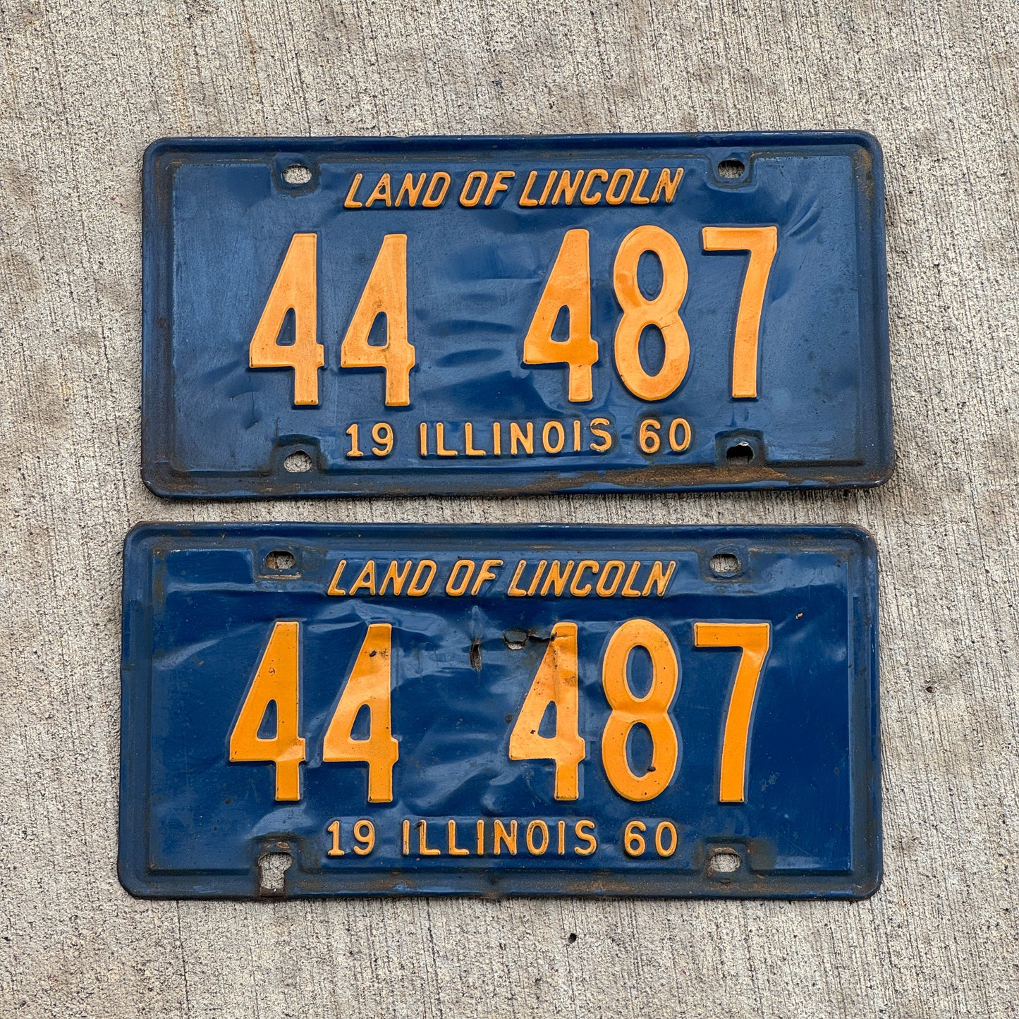 Photo of a 1960 Illinois License Plate Pair Auto Tag Garage Decor Vintage Repeat Repeating Orange Blue 44 487 with original patina