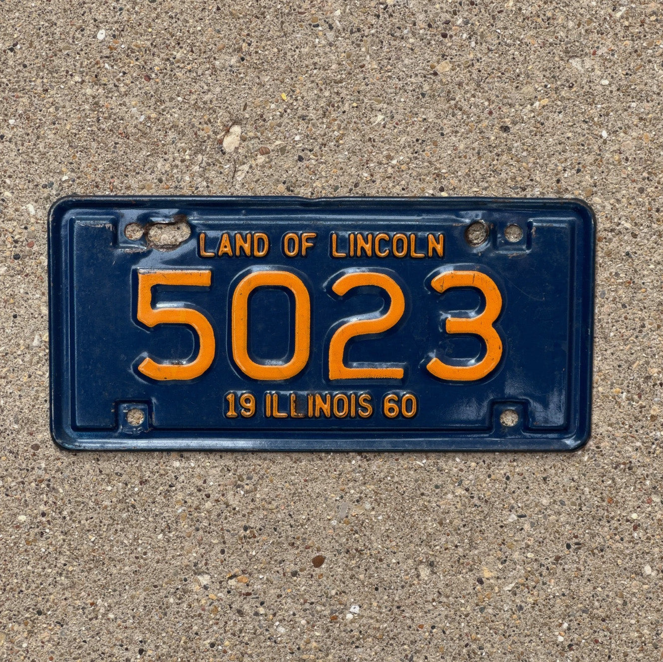 Photo of a 1960 Illinois Motorcycle License Plate Auto Tag Garage Decor Vintage 5023 with original patina
