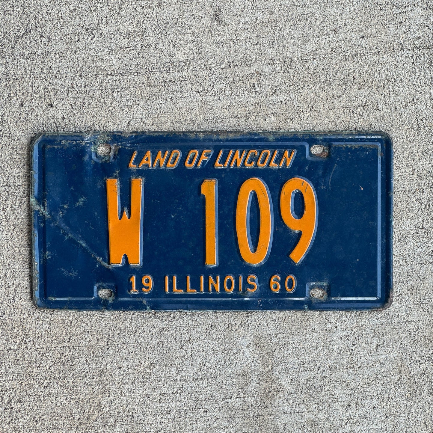 Photo of a 1960 Illinois Trailer License Plate Auto Tag Garage Decor Vintage Low Number Three Digit W 109 with original patina