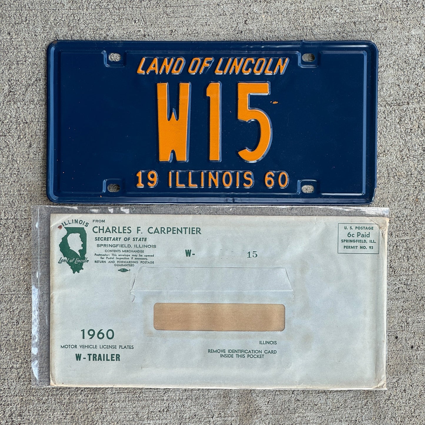 Photo of a 1960 Illinois Trailer License Plate Auto Tag Garage Decor Vintage Low Number Two Digit with Envelope W 15 with original patina