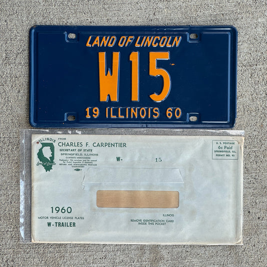 Photo of a 1960 Illinois Trailer License Plate Auto Tag Garage Decor Vintage Low Number Two Digit with Envelope W 15 with original patina