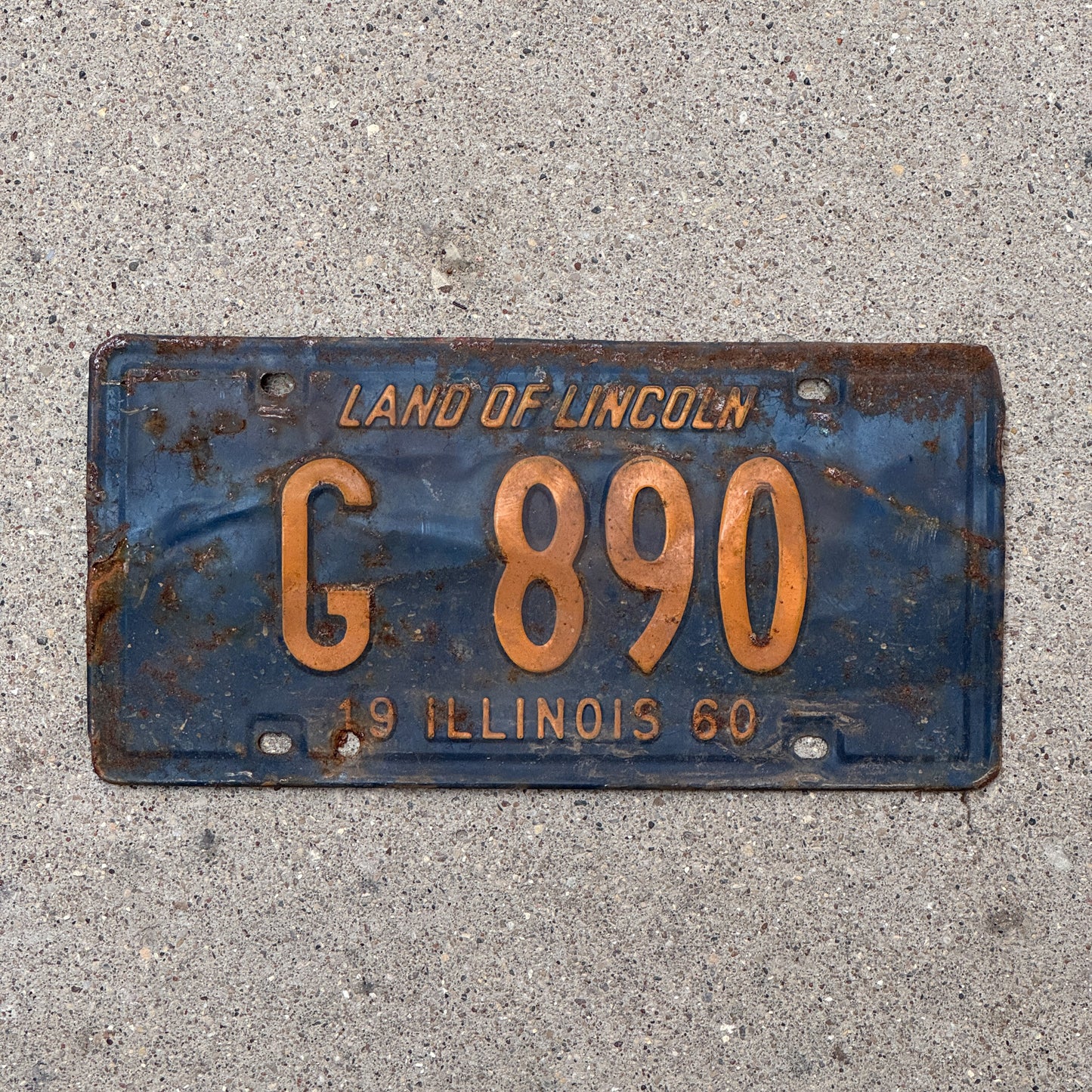 Photo of a 1960 Illinois Truck License Plate Auto Tag Garage Decor Vintage Low Number Three Digit Orange Blue G 890 with original patina