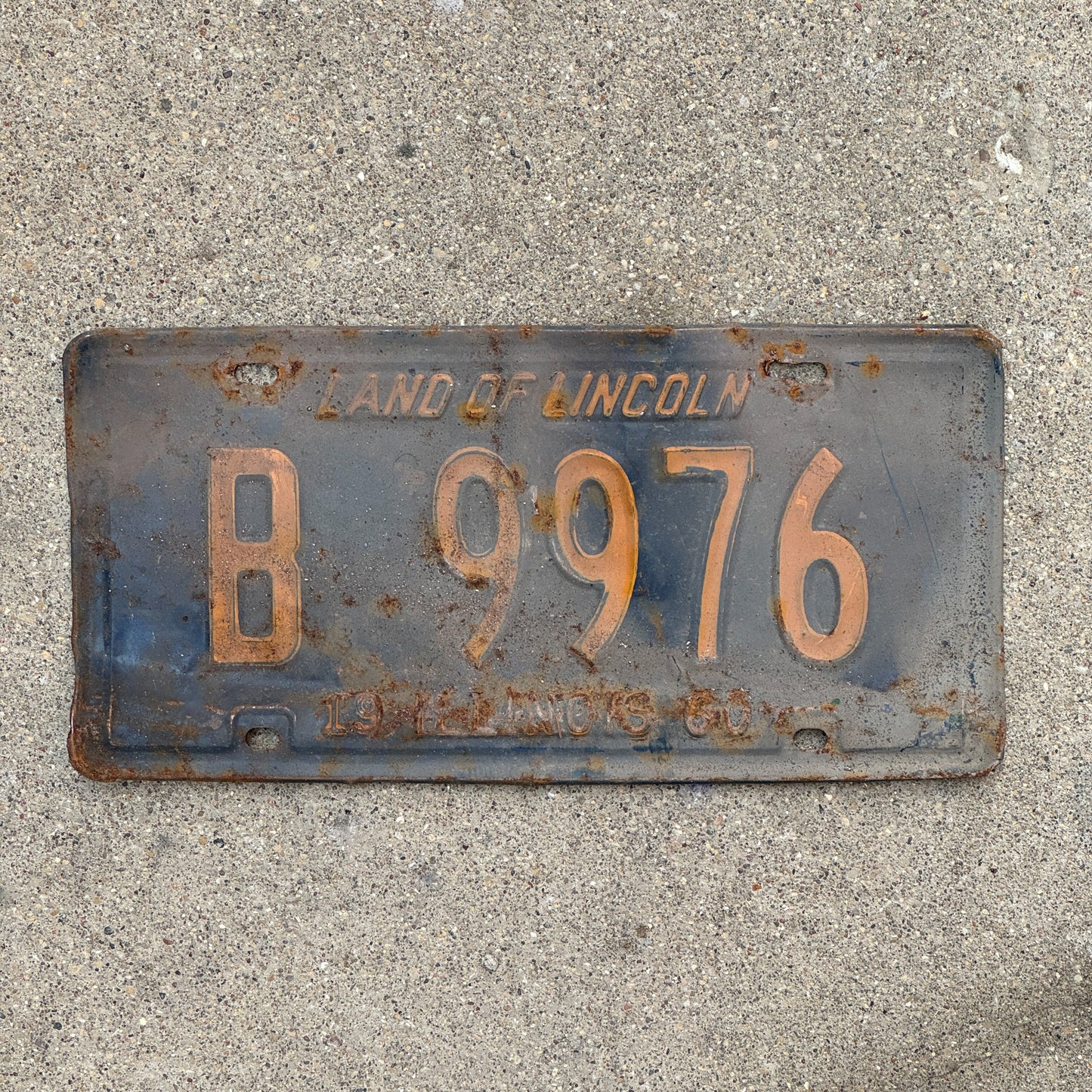 Photo of a 1960 Illinois Truck License Plate Auto Tag Garage Decor Vintage Orange Blue B 9976 with original patina