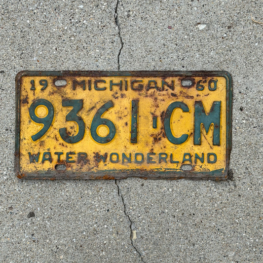 Photo of a 1960 Michigan Commercial License Plate Auto Tag Garage Decor Vintage 9361 CM with original patina