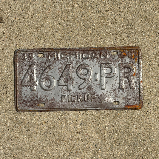 Photo of a 1960 Michigan Truck License Plate Auto Tag Garage Decor Vintage Pickup 4649 PR with original patina