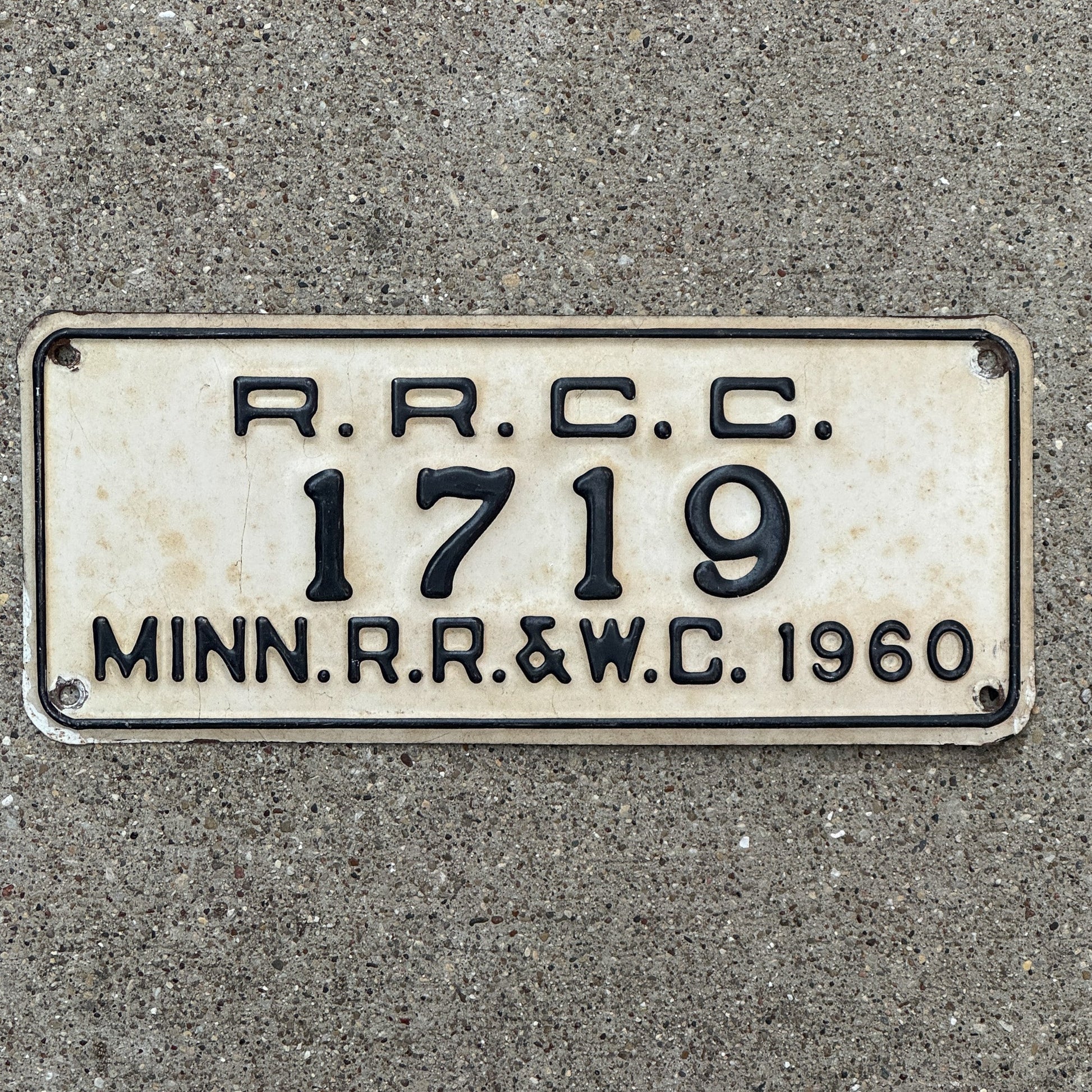 Photo of a 1960 Minnesota RRCC License Plate Auto Tag Garage Decor Vintage RR & WC Railroad Warehouse Commission 1719 with original patina