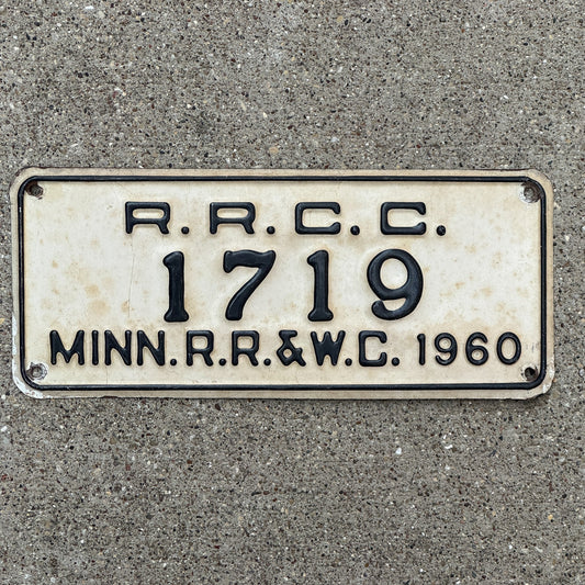 Photo of a 1960 Minnesota RRCC License Plate Auto Tag Garage Decor Vintage RR & WC Railroad Warehouse Commission 1719 with original patina