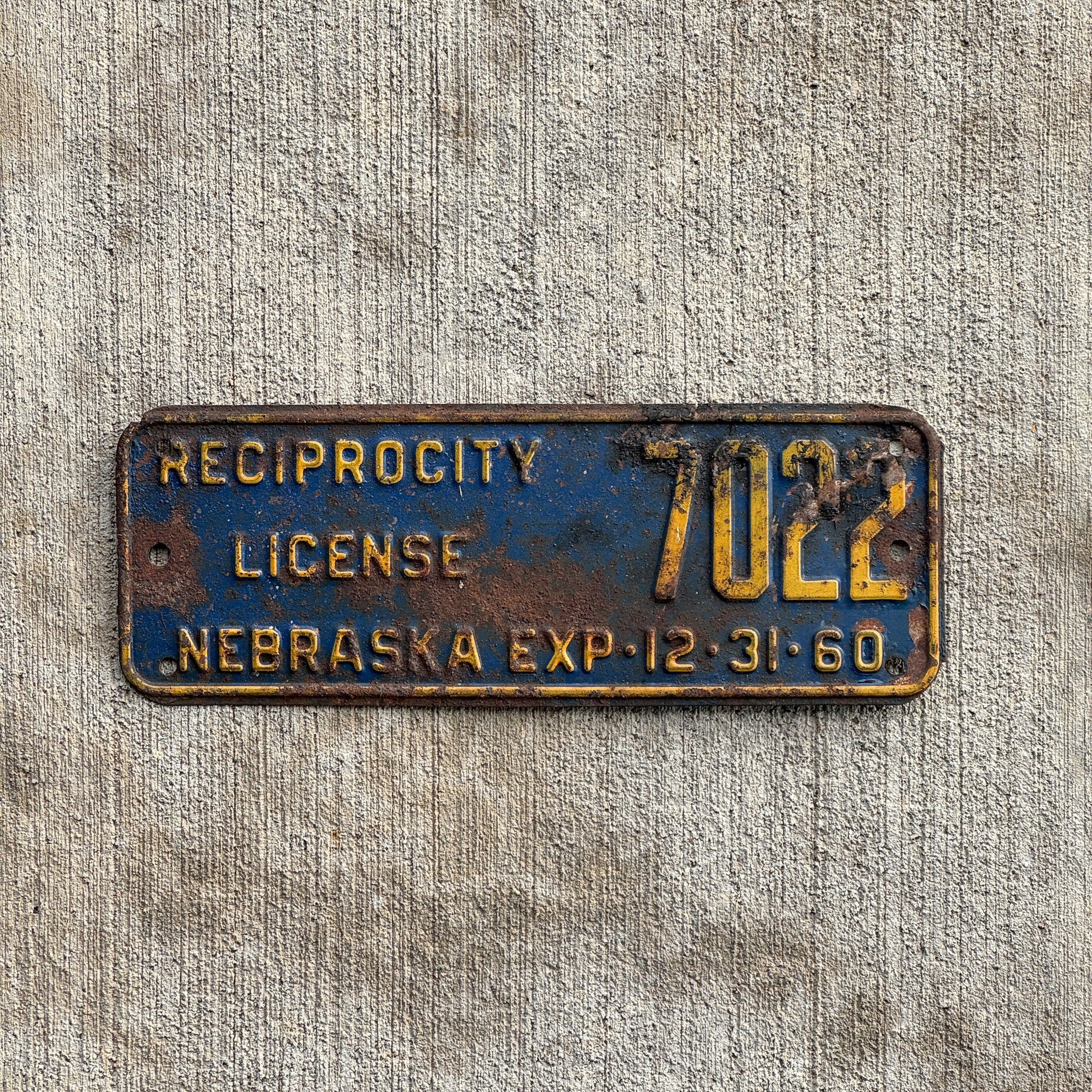 Photo of a 1960 Nebraska Reciprocity License Plate Auto Tag Garage Decor Vintage 7022 with original patina