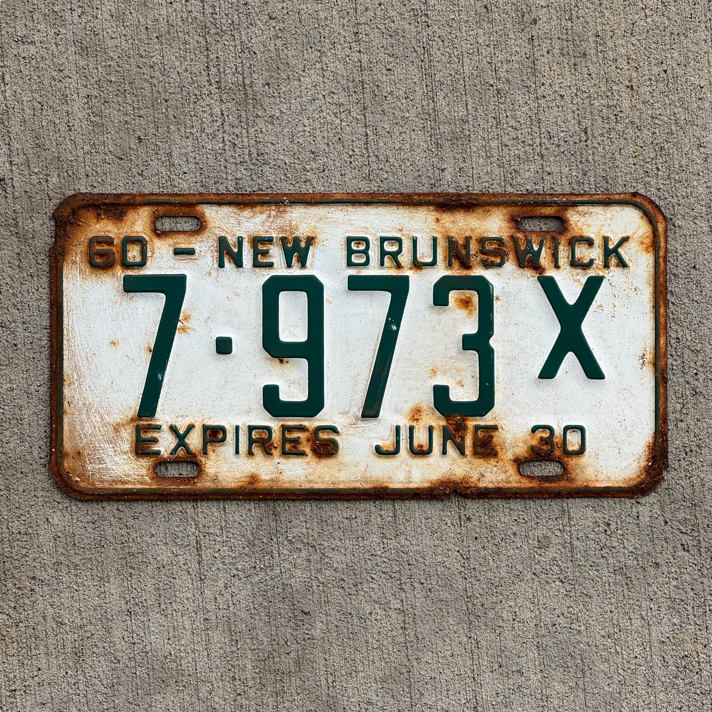 Photo of a 1960 New Brunswick Commercial Half Year License Plate Auto Tag 1 Vintage Garage 7 973 X with original patina