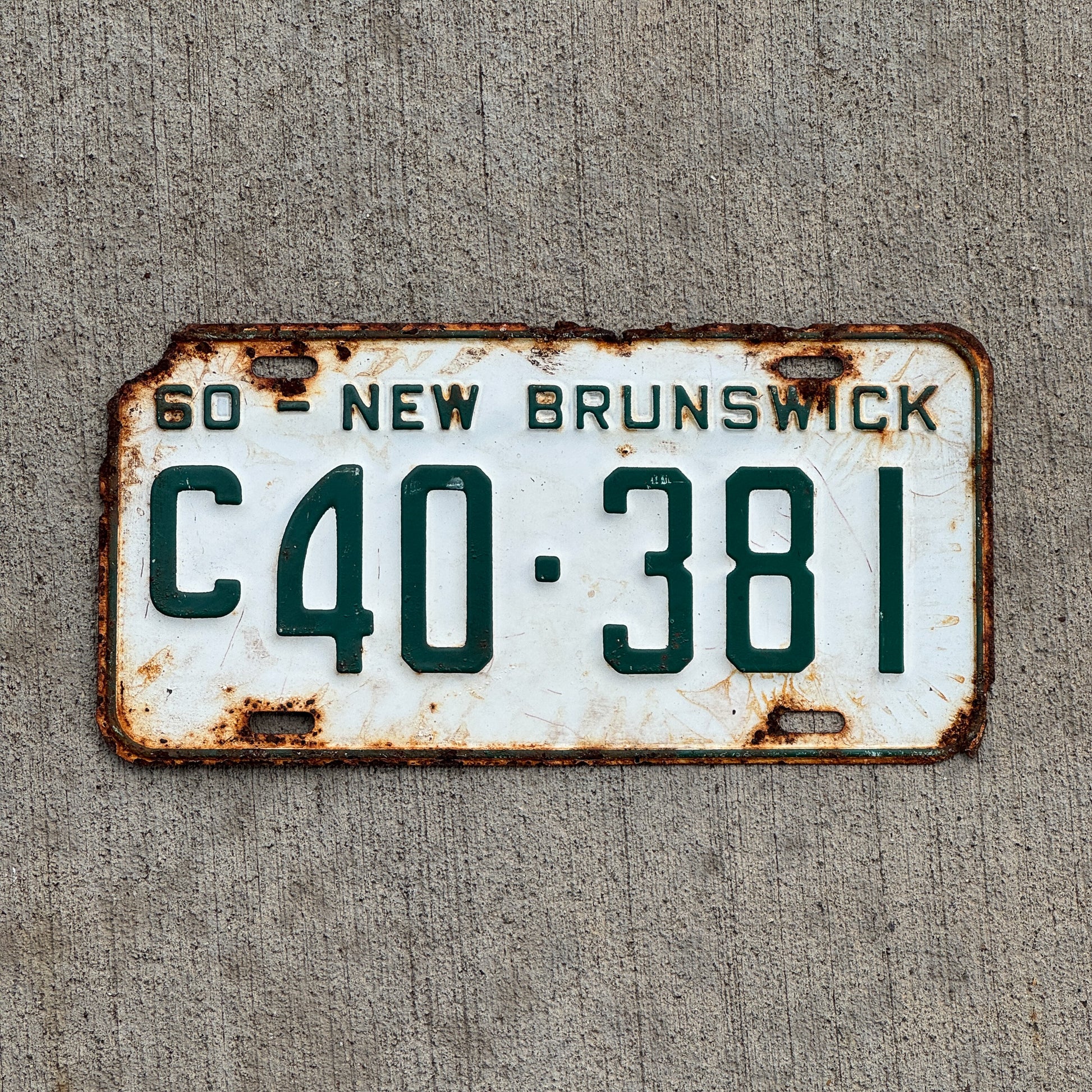 Photo of a 1960 New Brunswick Commercial License Plate Auto Tag 2 Vintage Garage C 40 381 with original patina