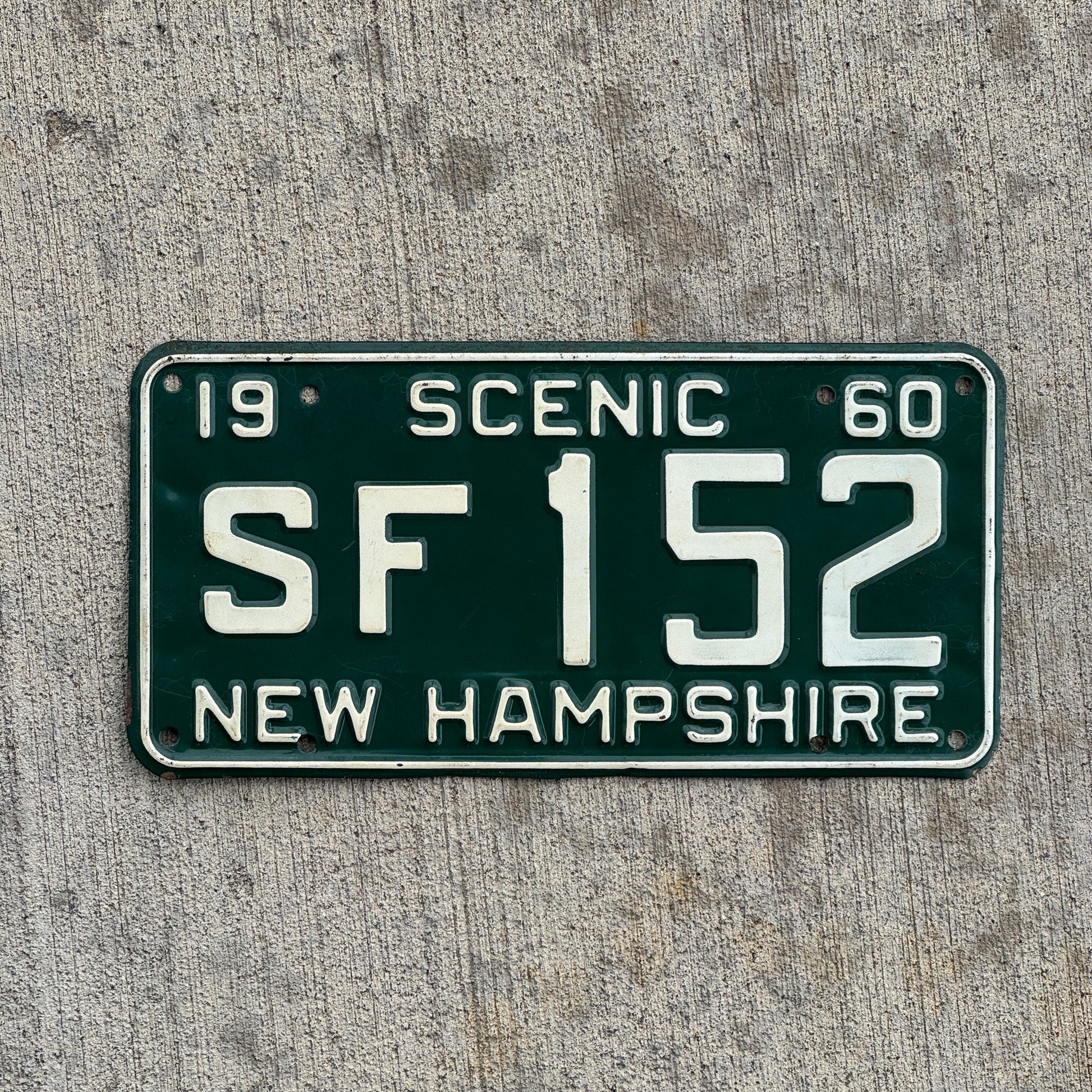 Photo of a 1960 New Hampshire License Plate Auto Tag Garage Decor Vintage SF 152 with original patina