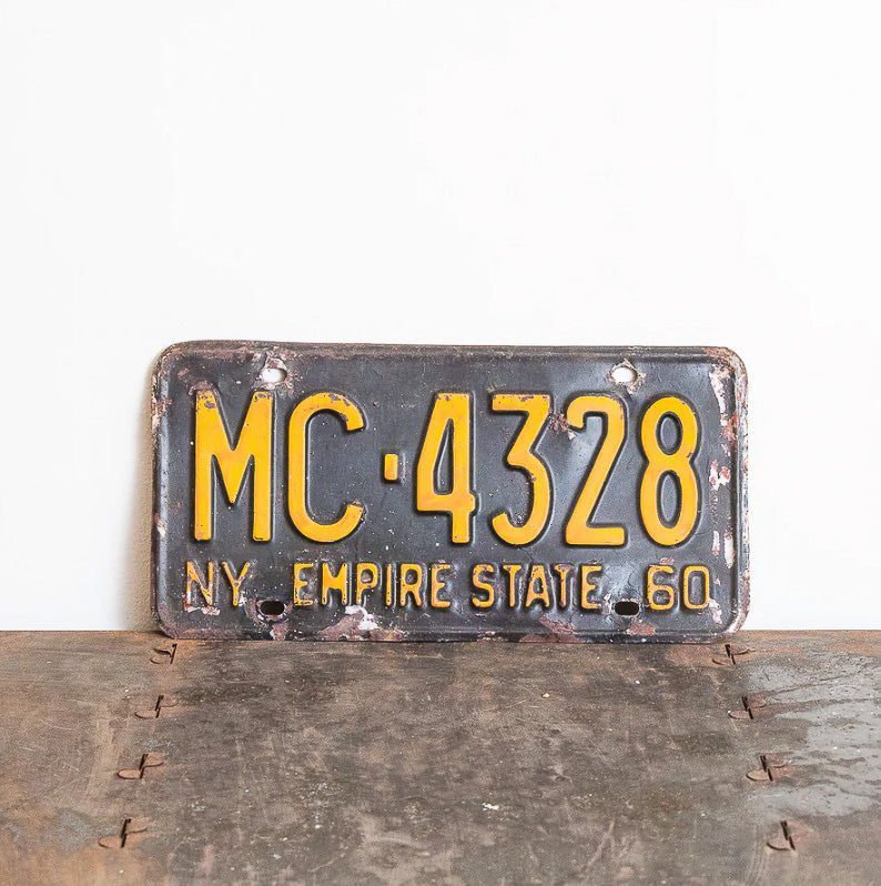 Photo of a 1960 New York License Plate Auto Tag Garage Decor Vintage MC 4328 with original patina