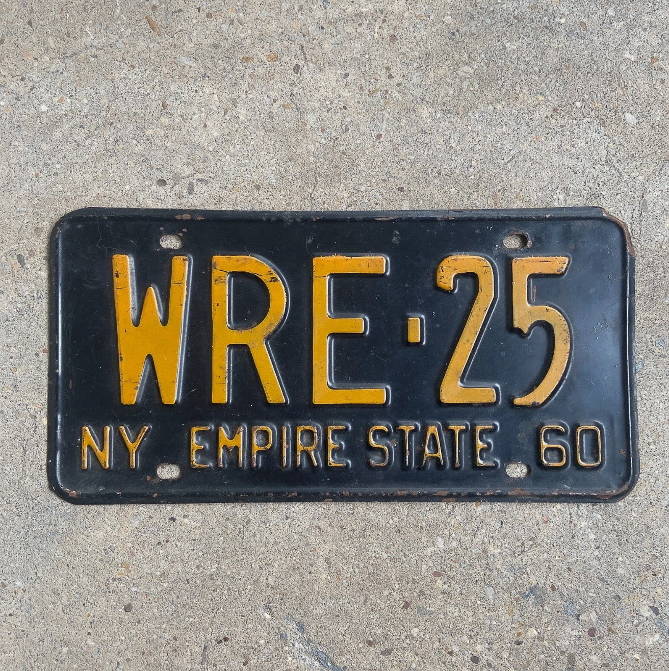 Photo of a 1960 New York License Plate Auto Tag Garage Decor Vintage WRE 25 with original patina