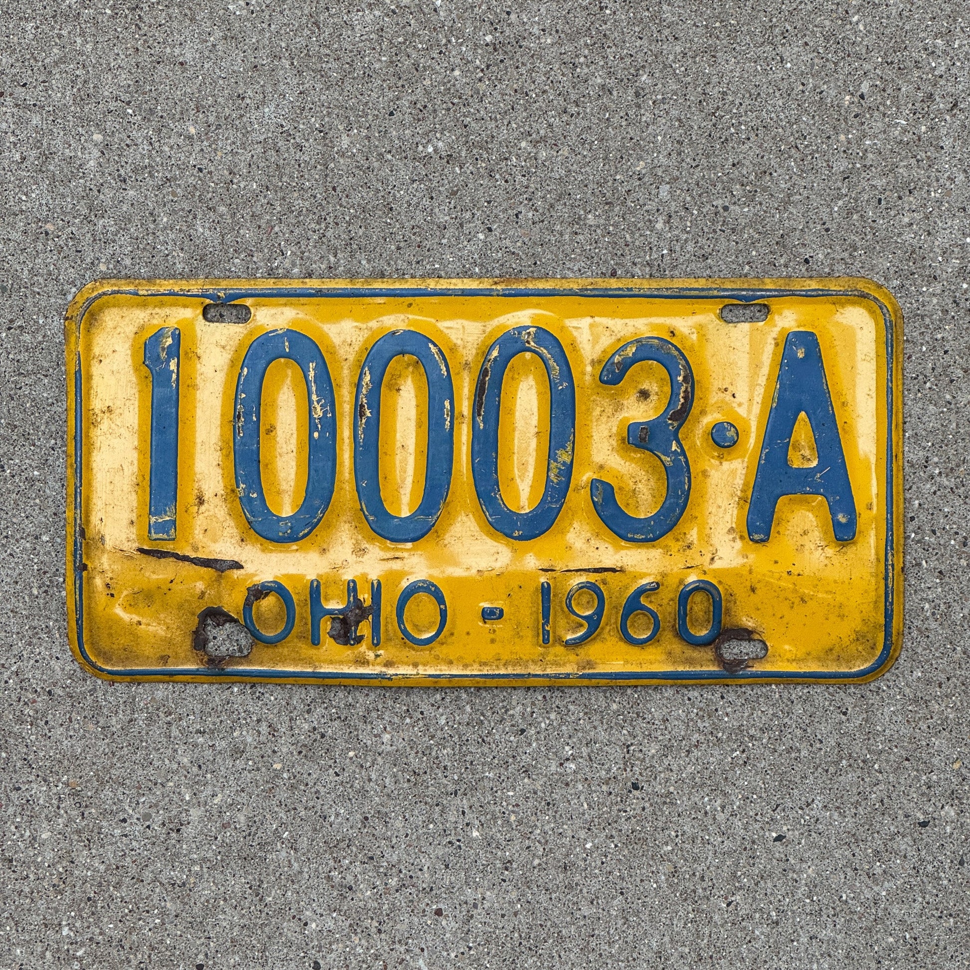 Photo of a 1960 Ohio License Plate Auto Tag Garage Decor Vintage 10003 A with original patina