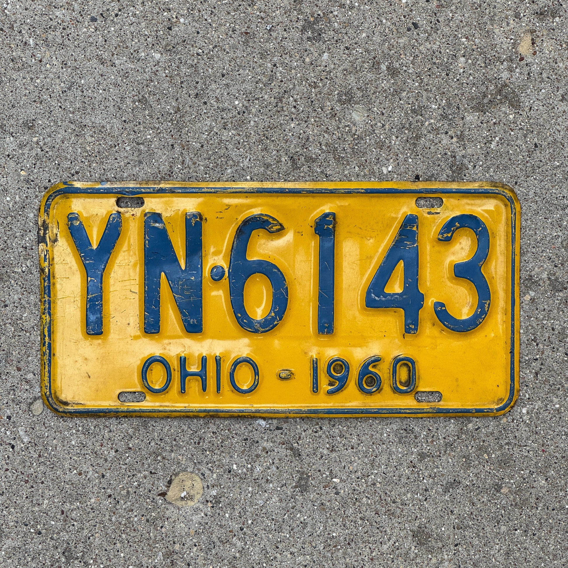 Photo of a 1960 Ohio License Plate Auto Tag Garage Decor Vintage YN 6143 with original patina