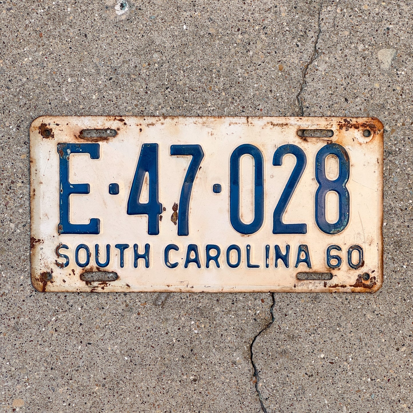 Photo of a 1960 South Carolina License Plate Auto Tag Garage Decor Vintage E 47 028 with original patina