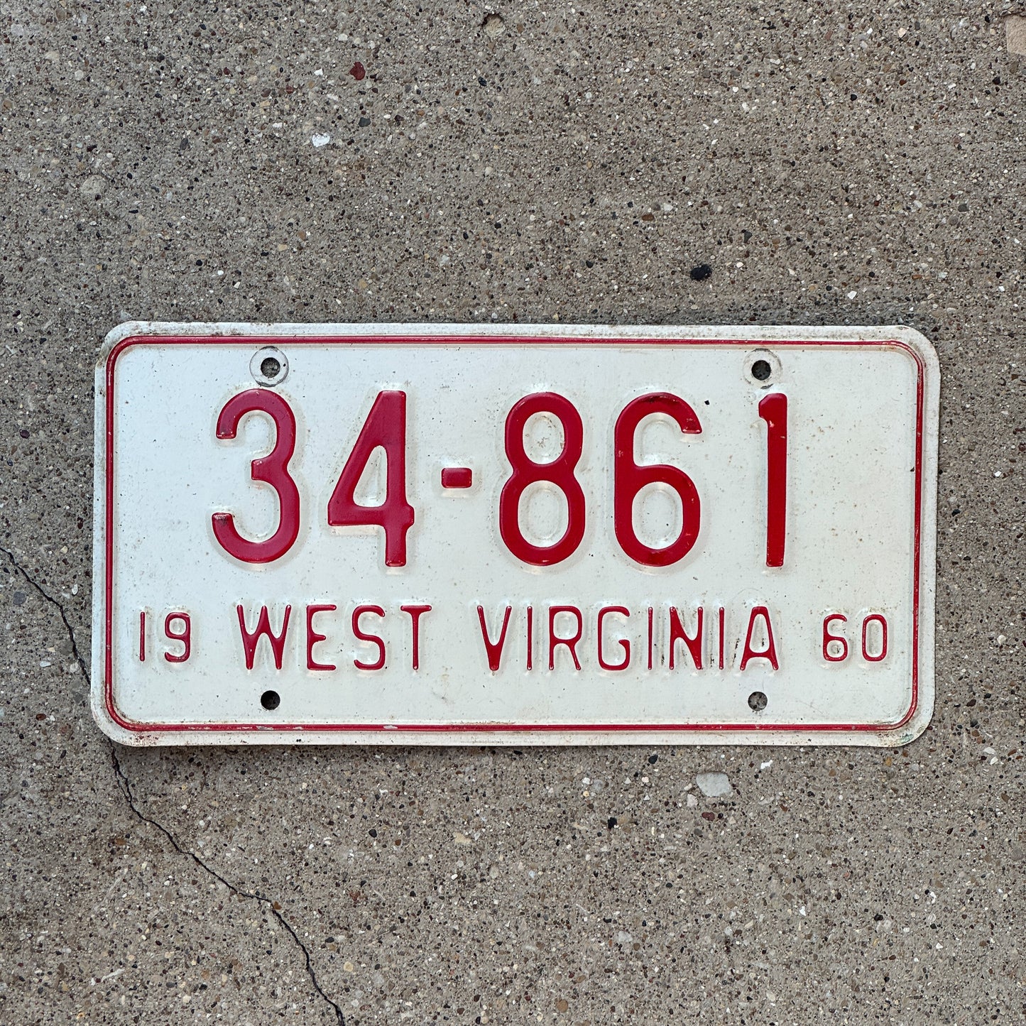 Photo of a 1960 West Virginia License Plate Auto Tag Garage Decor Vintage 34 861 with original patina