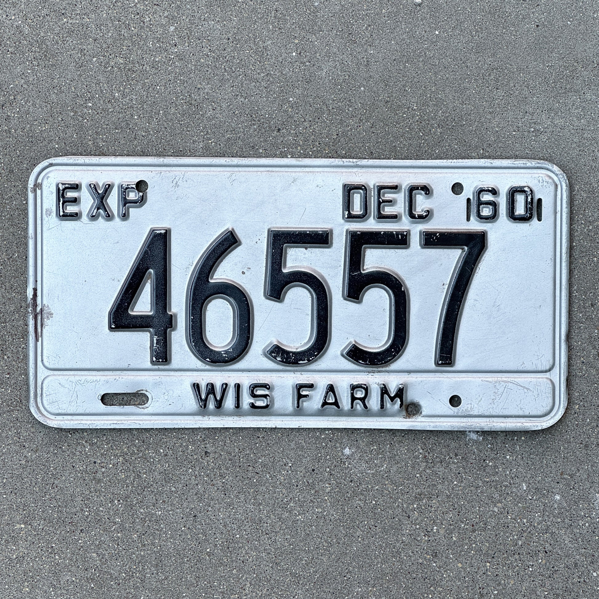 Photo of a 1960 Wisconsin Farm License Plate Auto Tag Garage Decor Vintage 46557 with original patina