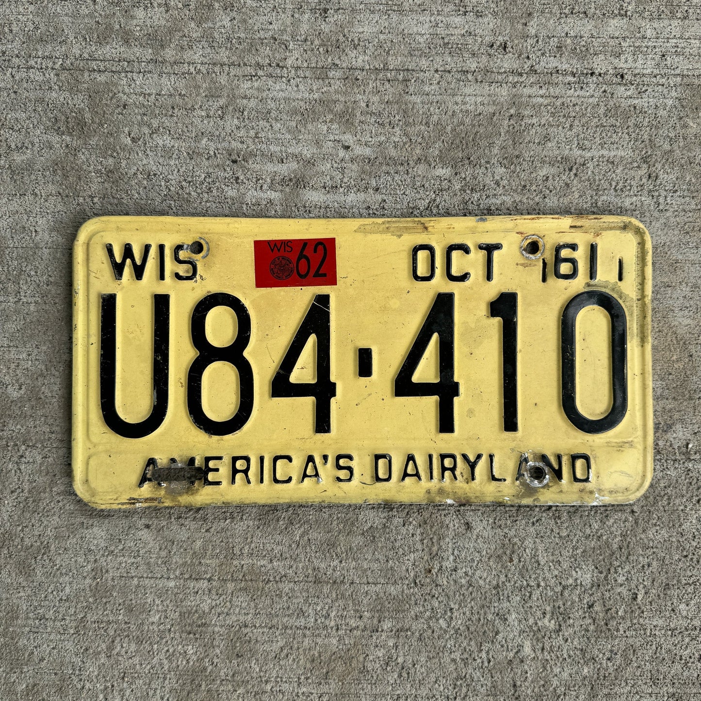 Photo of a 1961 1962 Wisconsin License Plate Auto Tag Garage Decor Vintage U84 410 with original patina