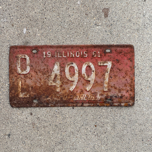 Photo of a 1961 Illinois Dealer License Plate Auto Tag Garage Decor Vintage 4997 with original patina