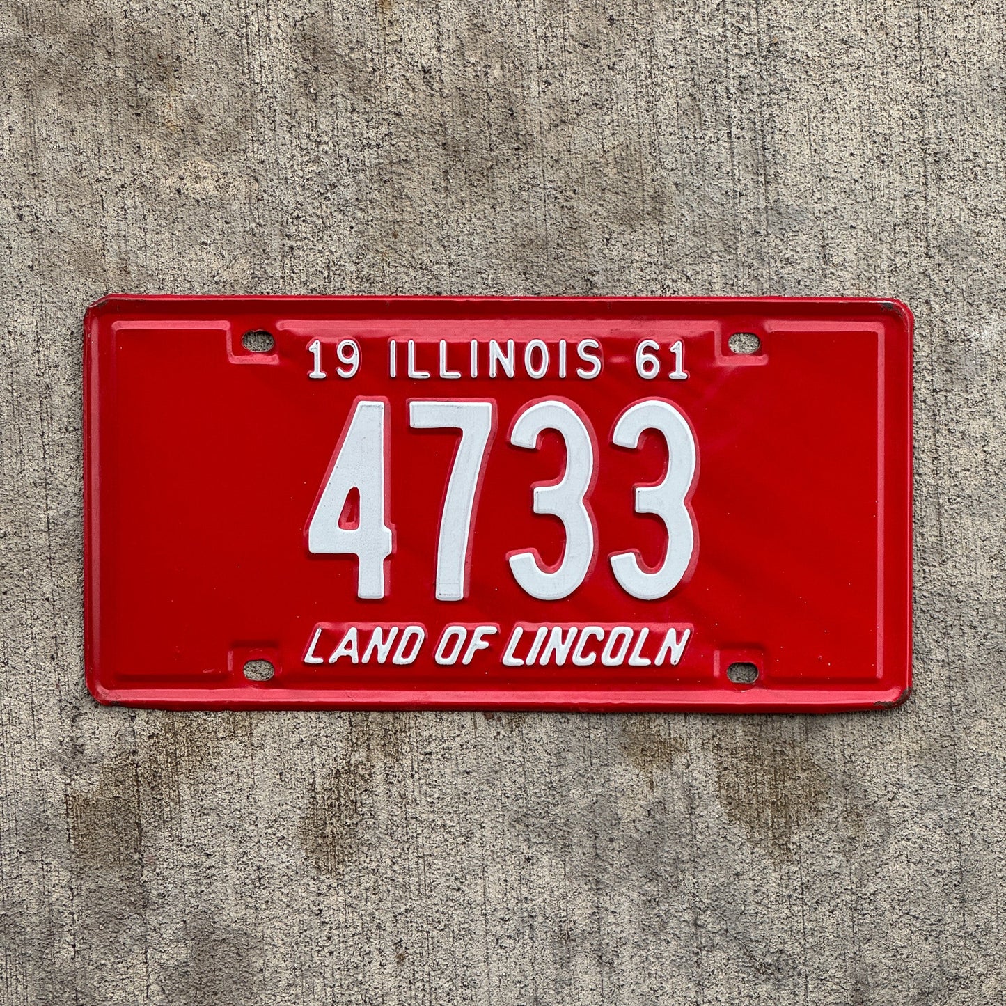 Photo of a 1961 Illinois License Plate Auto Tag Garage Decor Vintage Low Number Four Digit 4733 with original patina