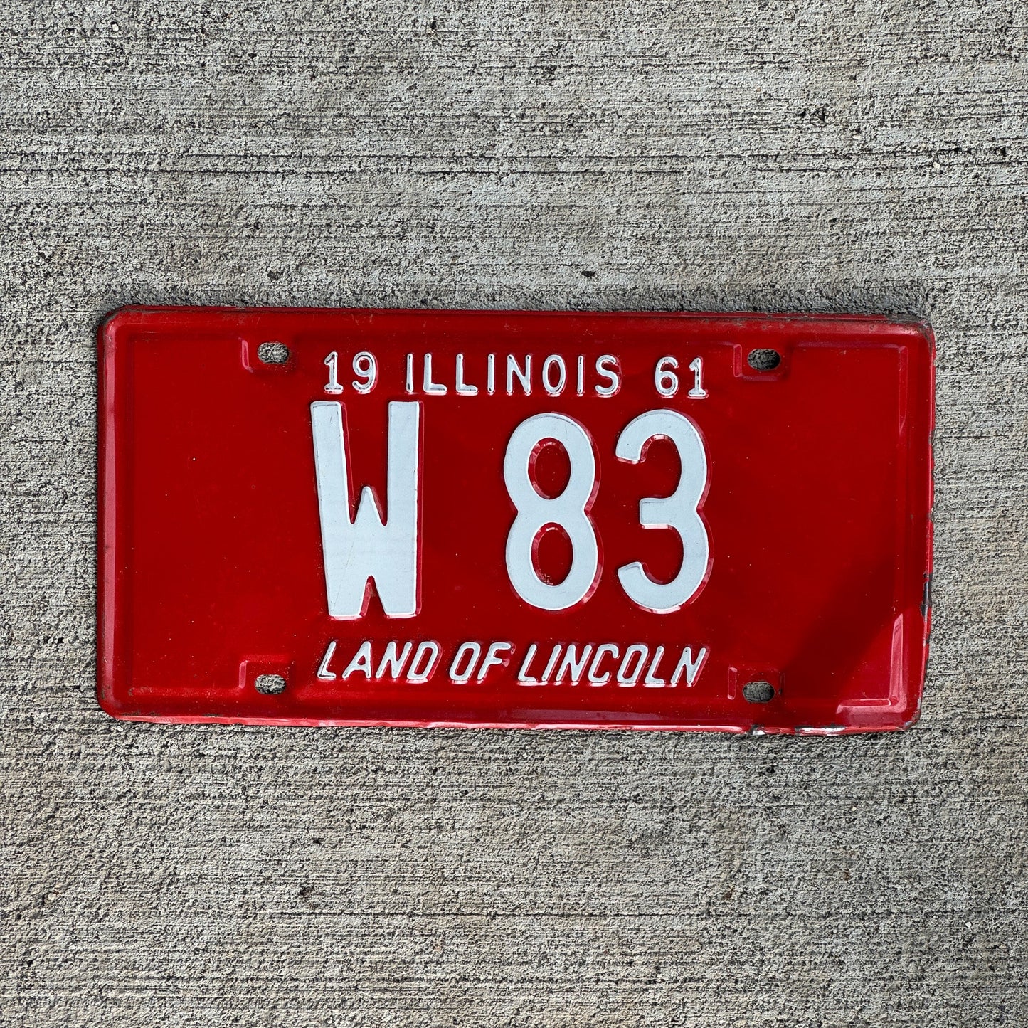Photo of a 1961 Illinois Trailer License Plate Auto Tag Garage Decor Vintage Low Number Two Digit W 83 with original patina