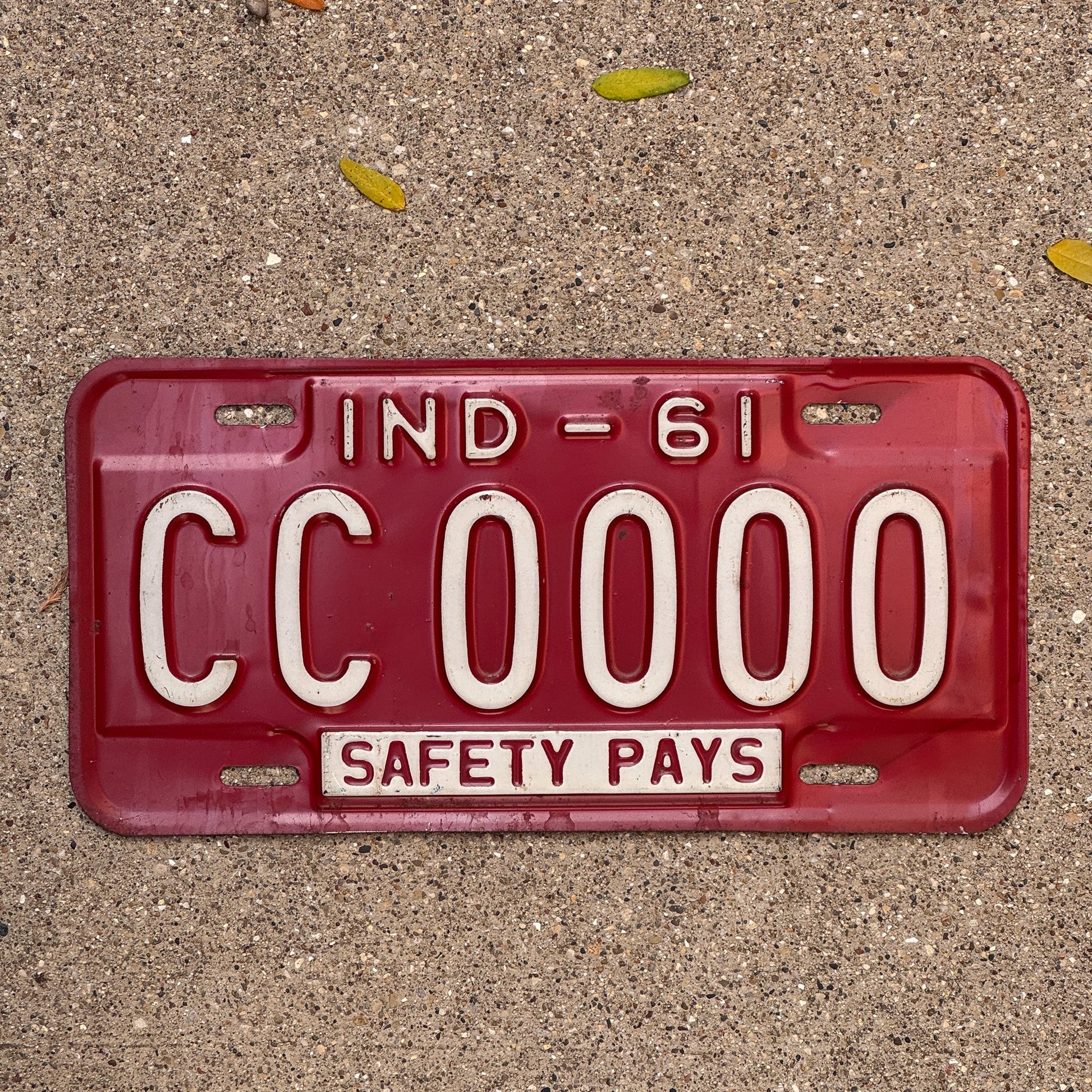 Photo of a 1961 Indiana Sample License Plate Auto Tag Garage Decor Vintage CC 0000 with original patina