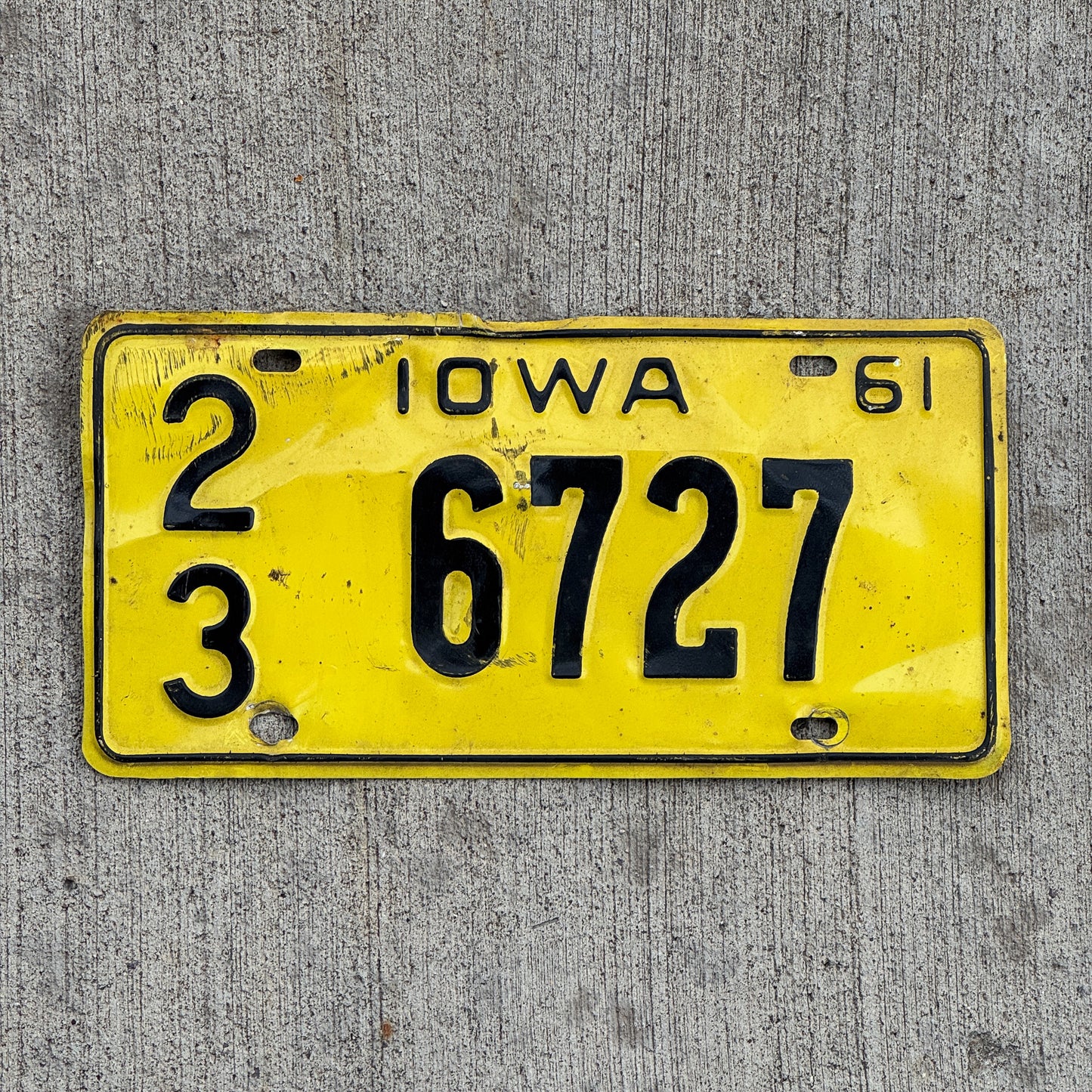Photo of a 1961 Iowa License Plate Auto Tag Garage Decor Vintage 23 6727 with original patina