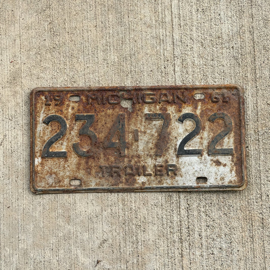 Photo of a 1961 Michigan Trailer License Plate Auto Tag Garage Decor Vintage 234 722 with original patina