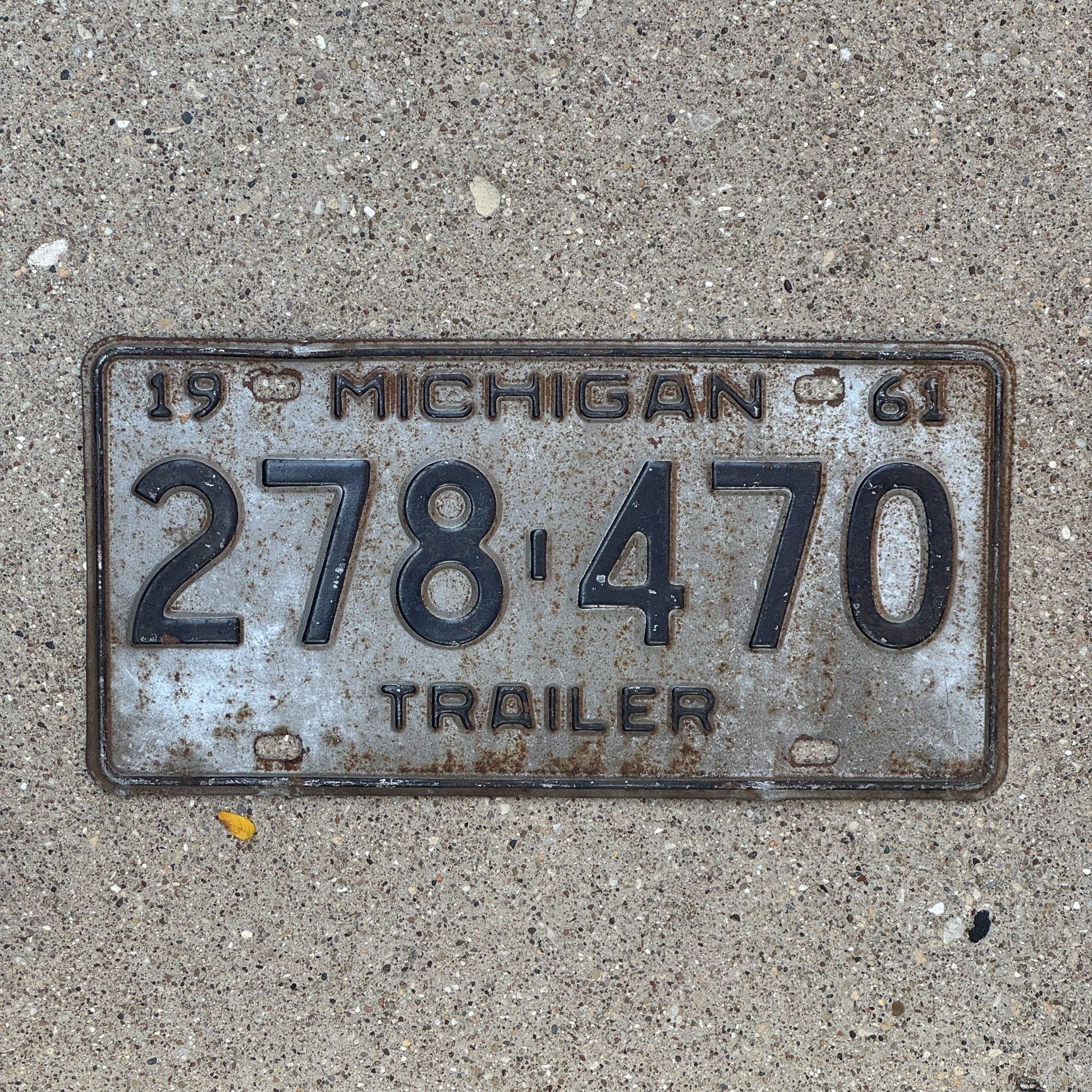 Photo of a 1961 Michigan Trailer License Plate Auto Tag Garage Decor Vintage 278 470